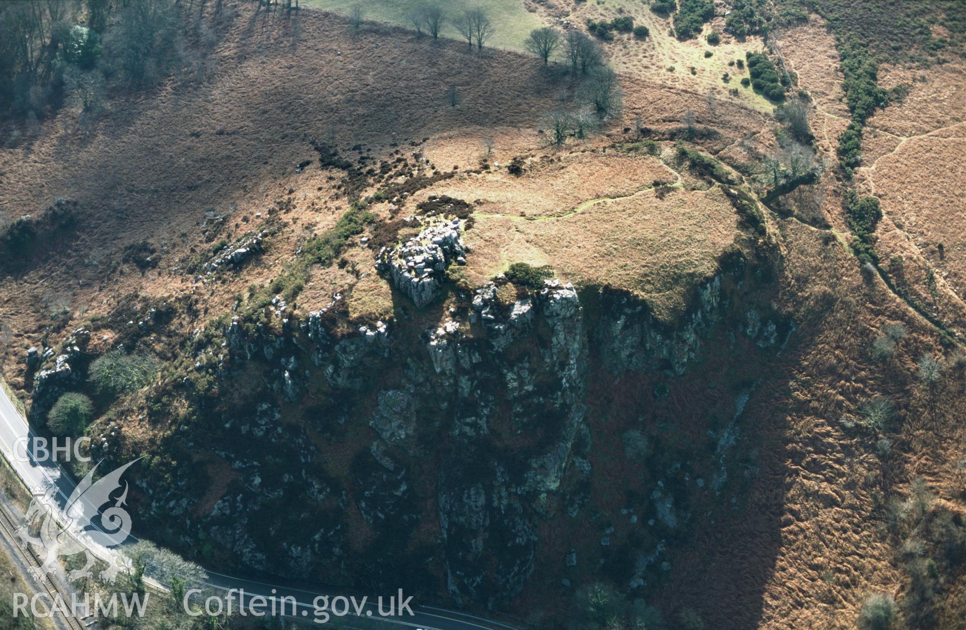 RCAHMW colour slide oblique aerial photograph of enclosure at Great Treffgarne Rocks, Wolfscastle, taken by C.R.Musson on the 27/02/1996