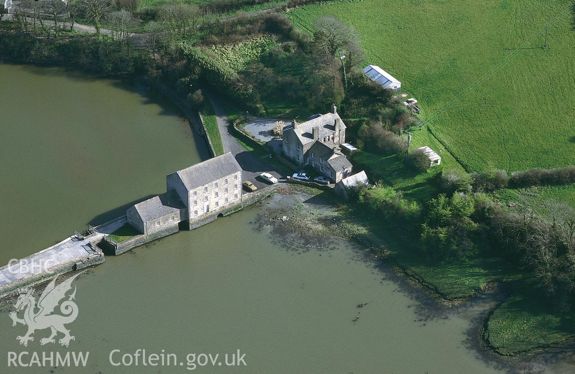 RCAHMW colour oblique aerial photograph of Carew Tidal Mill. Taken by C R Musson on 13/04/1995