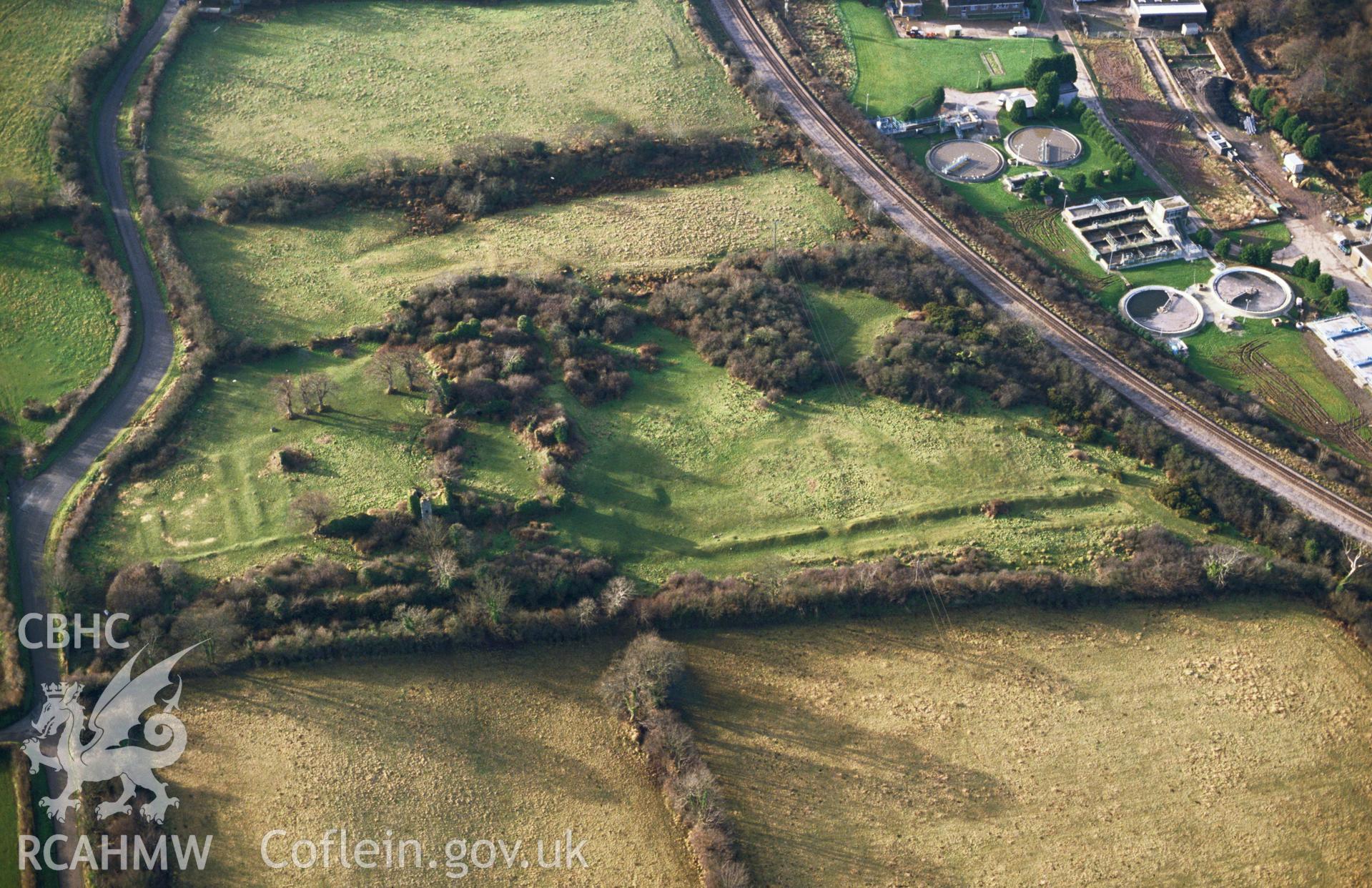 Slide of RCAHMW colour oblique aerial photograph of the ruins of Haroldston Mansion, Merlins Bridge,Haverfordwest taken by C.R. Musson, 1993.