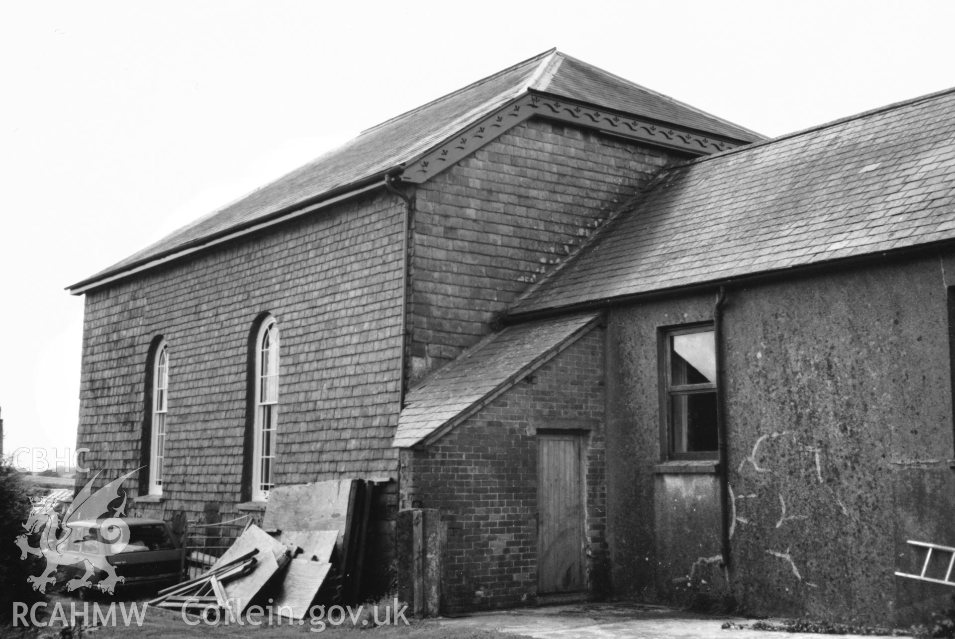 Digital copy of a black and white photograph showing an exterior view of Gwastad Calvinistic Methodist Chapel, taken by Robert Scourfield, 1996.