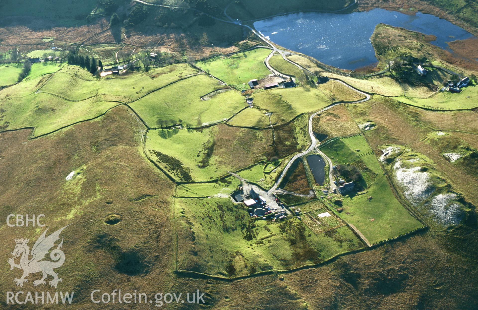 Slide of RCAHMW colour oblique aerial photograph of Bryn Rhosau Cairn Ystumtuen, taken by Toby Driver 2001