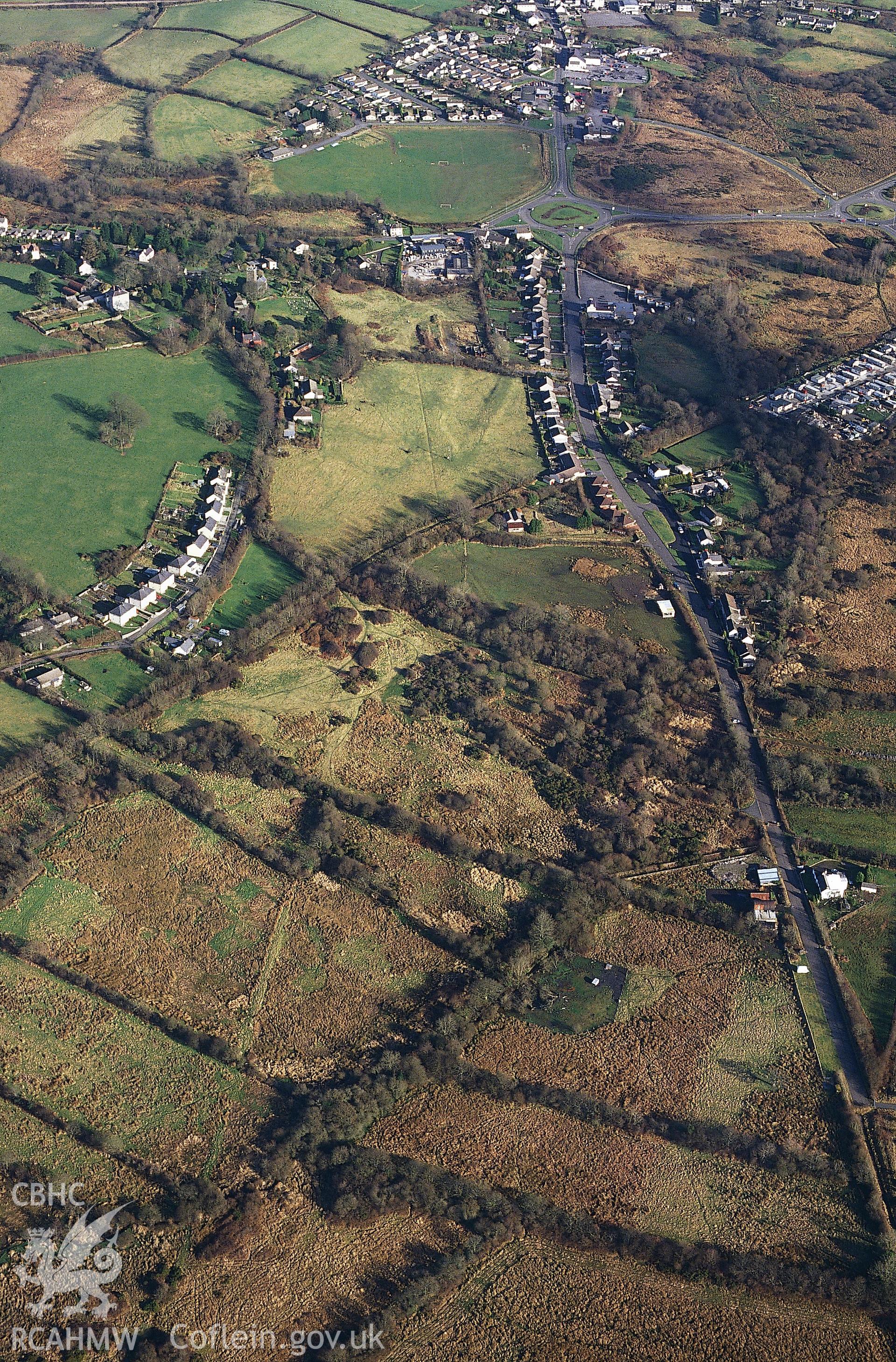 RCAHMW colour slide oblique aerial photograph of probable tramways NW of Begelly, Kilgetty-begelly, taken by C.R. Musson, 28/01/94