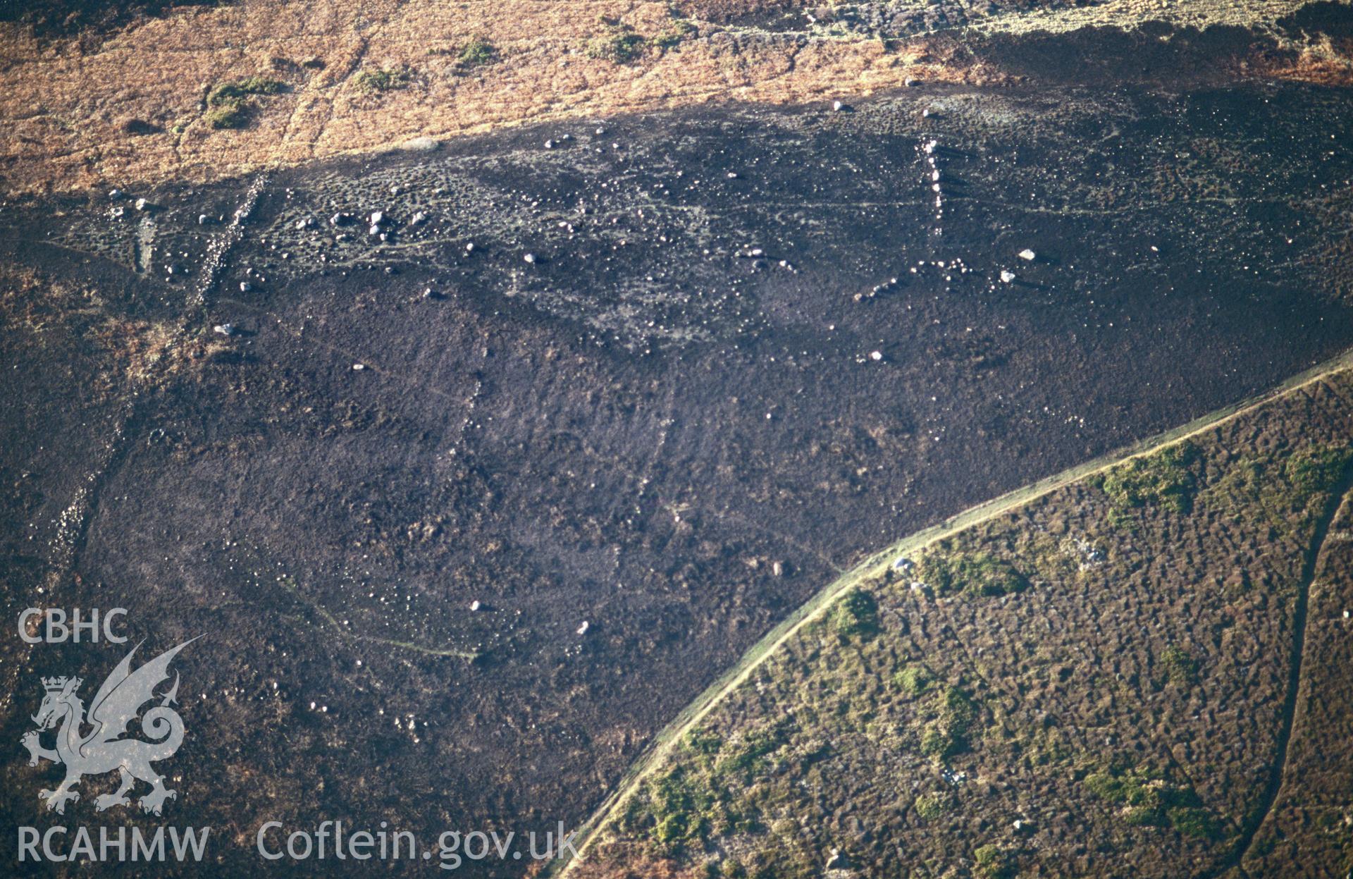 RCAHMW colour slide oblique aerial photograph of Carn Llidi Enclosures;  Penmaen Dewi Field System, St Davids and the Cathedral Close, taken by C.R.Musson on the 07/02/1997