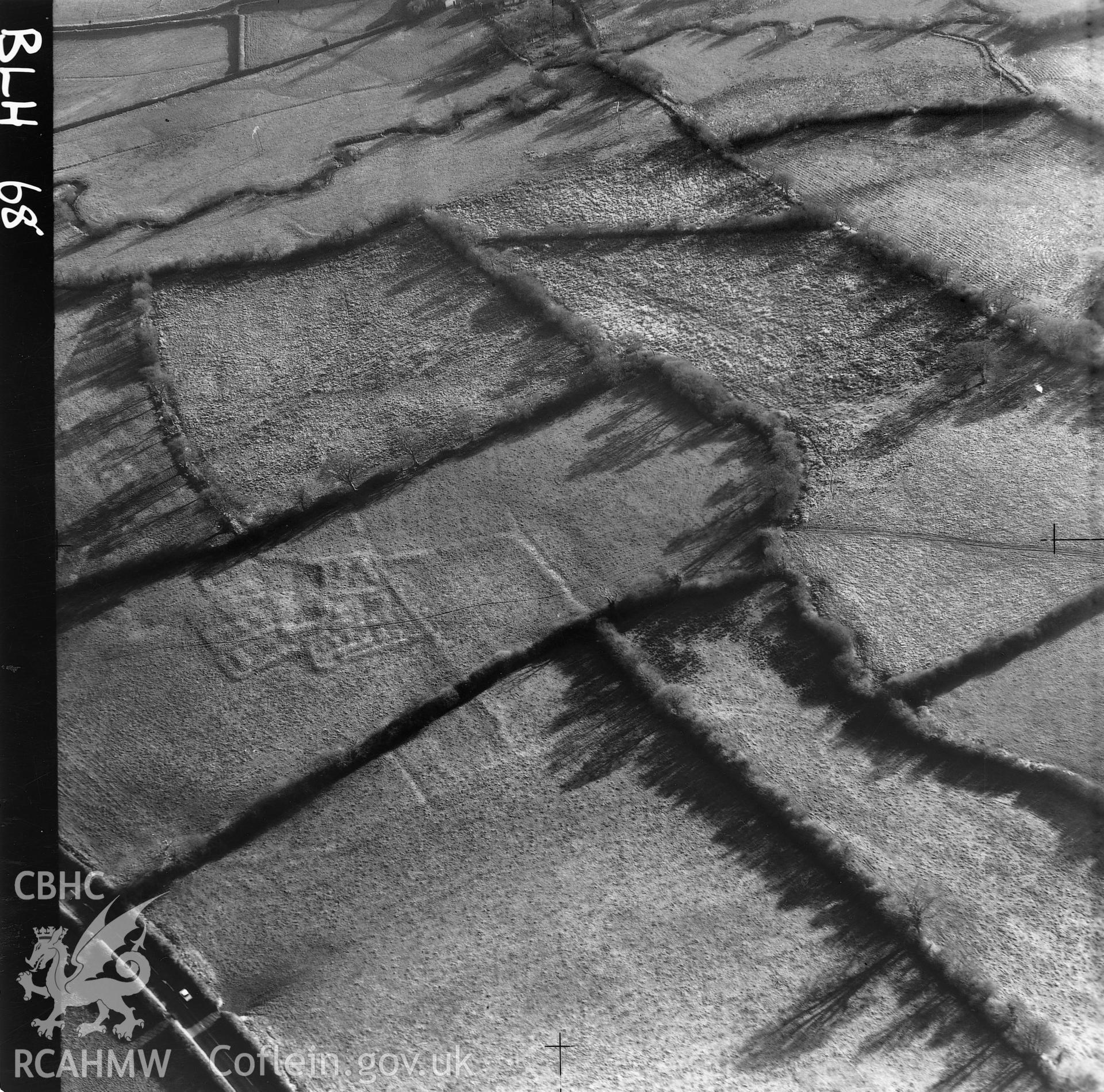 Black and white aerial photograph showing enclosure marks at Pengawse, taken by Cambridge University Committee for Aerial Photography.