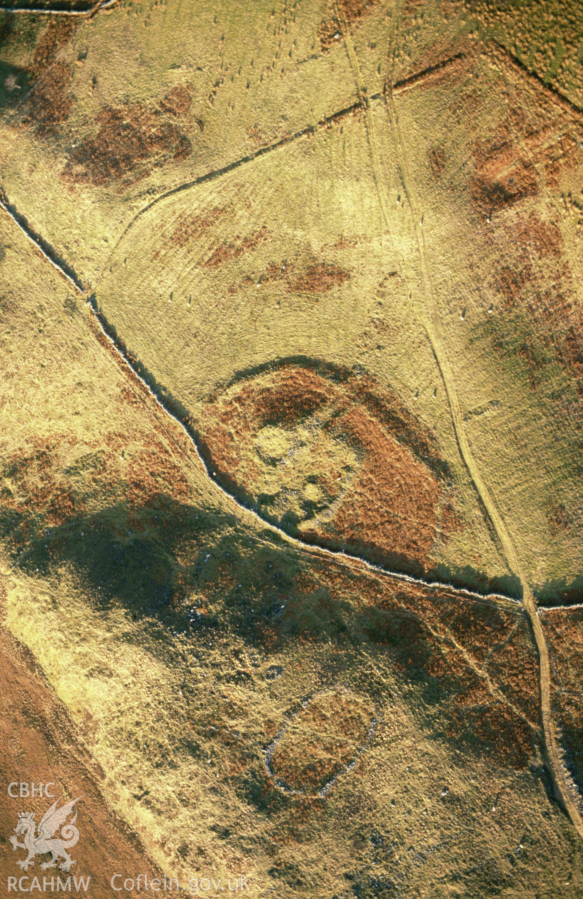 RCAHMW colour slide oblique aerial photograph of Ffridd Bod-y-funddai Settlement, Trawsfynydd, taken on 26/02/1991 by CR Musson