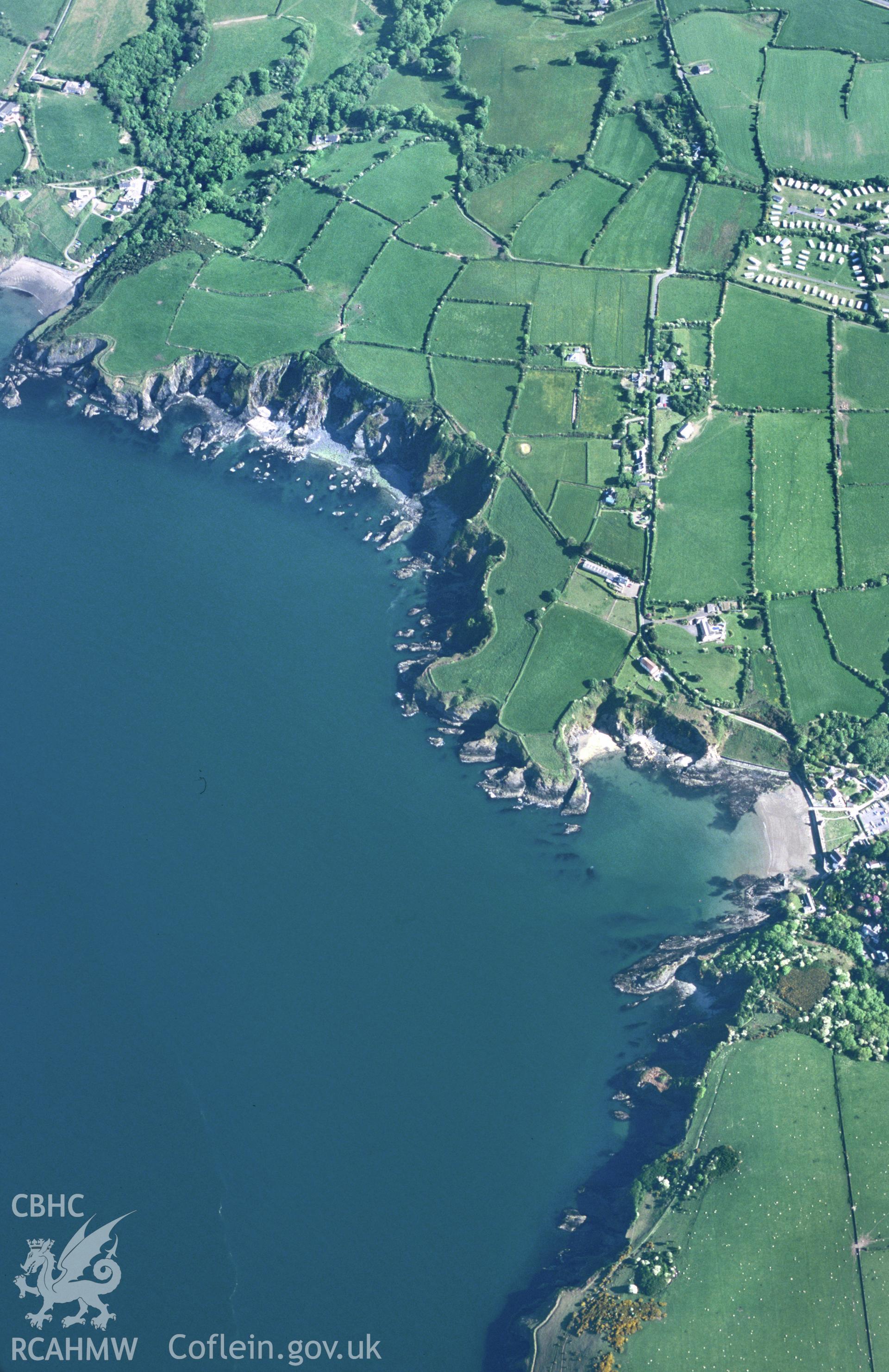 RCAHMW colour slide oblique aerial photograph of Dinas Island Castell, Dinas Cross, taken by T.G.Driver on the 22/05/2000