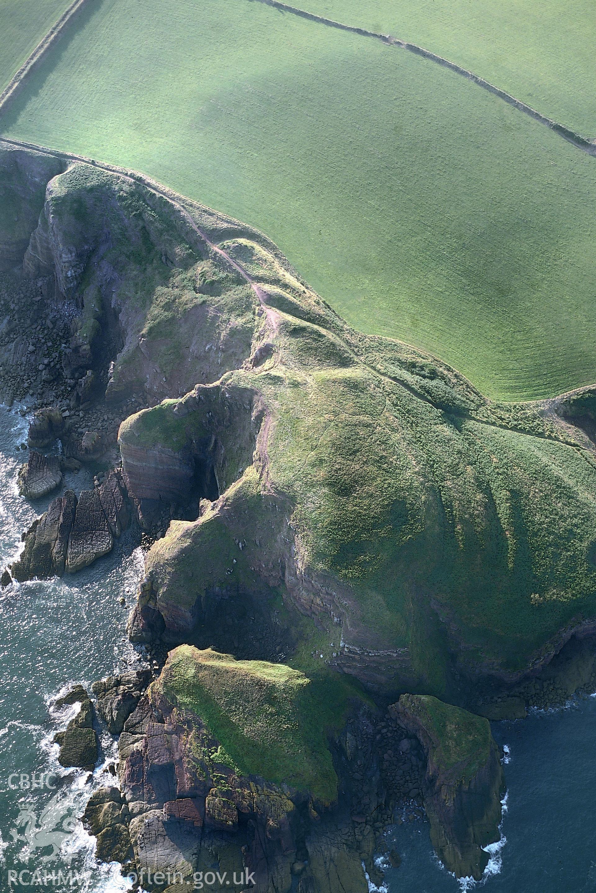 RCAHMW colour slide oblique aerial photograph of Greenala Camp, Stackpole, taken by T.G.Driver on the 23/08/2000