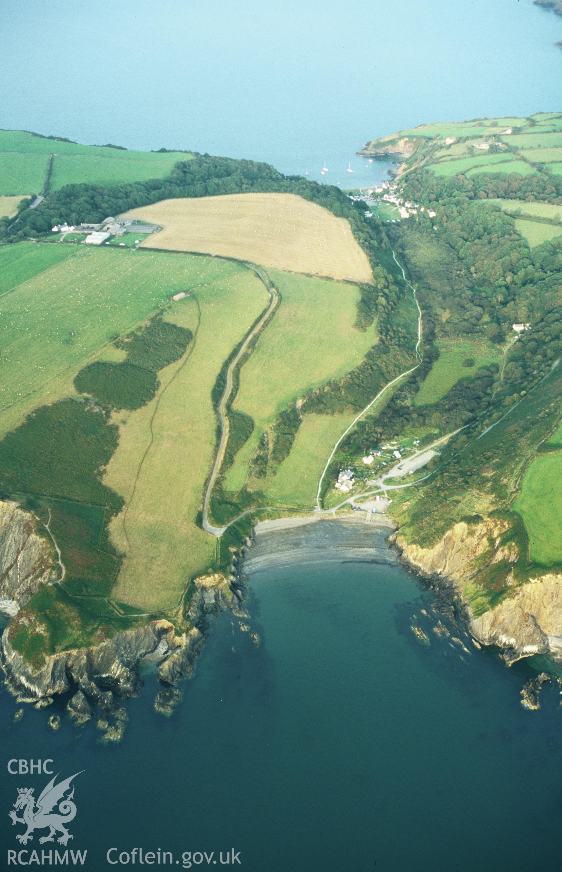 RCAHMW colour oblique aerial photograph of Pwllgwaelod, Dinas Island, landscape from west. Taken by Toby Driver on 02/09/2002