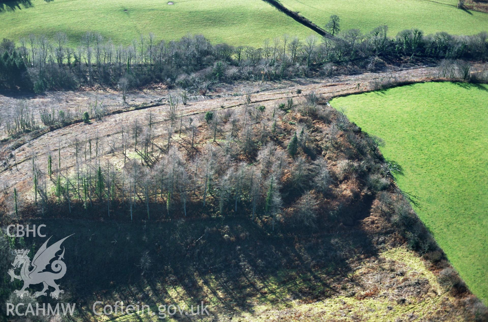 RCAHMW colour slide oblique aerial photograph of Holgan Camp, Llawhaden, taken by C.R.Musson on the 07/02/1997