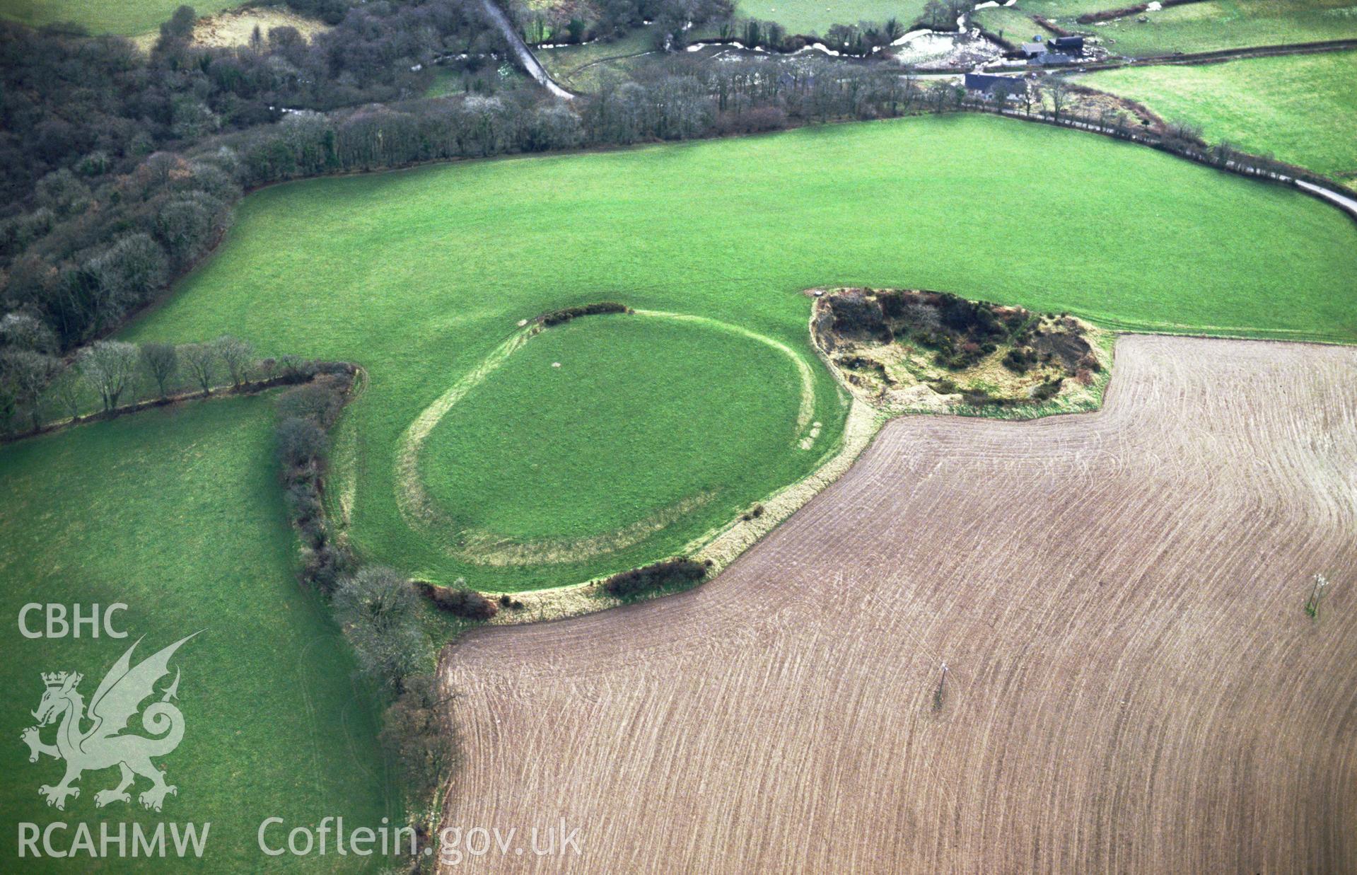 RCAHMW colour slide oblique aerial photograph of Faenor Gaer, Llawhaden, taken by C.R. Musson, 28/01/94