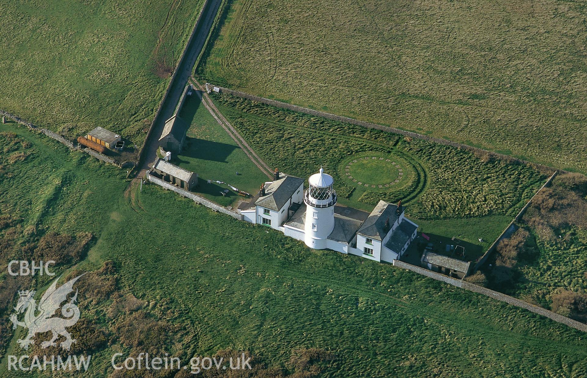 Slide of RCAHMW colour oblique aerial photograph of Caldey Lighthouse, Caldey Island, taken by C.R. Musson, 13/4/1995.