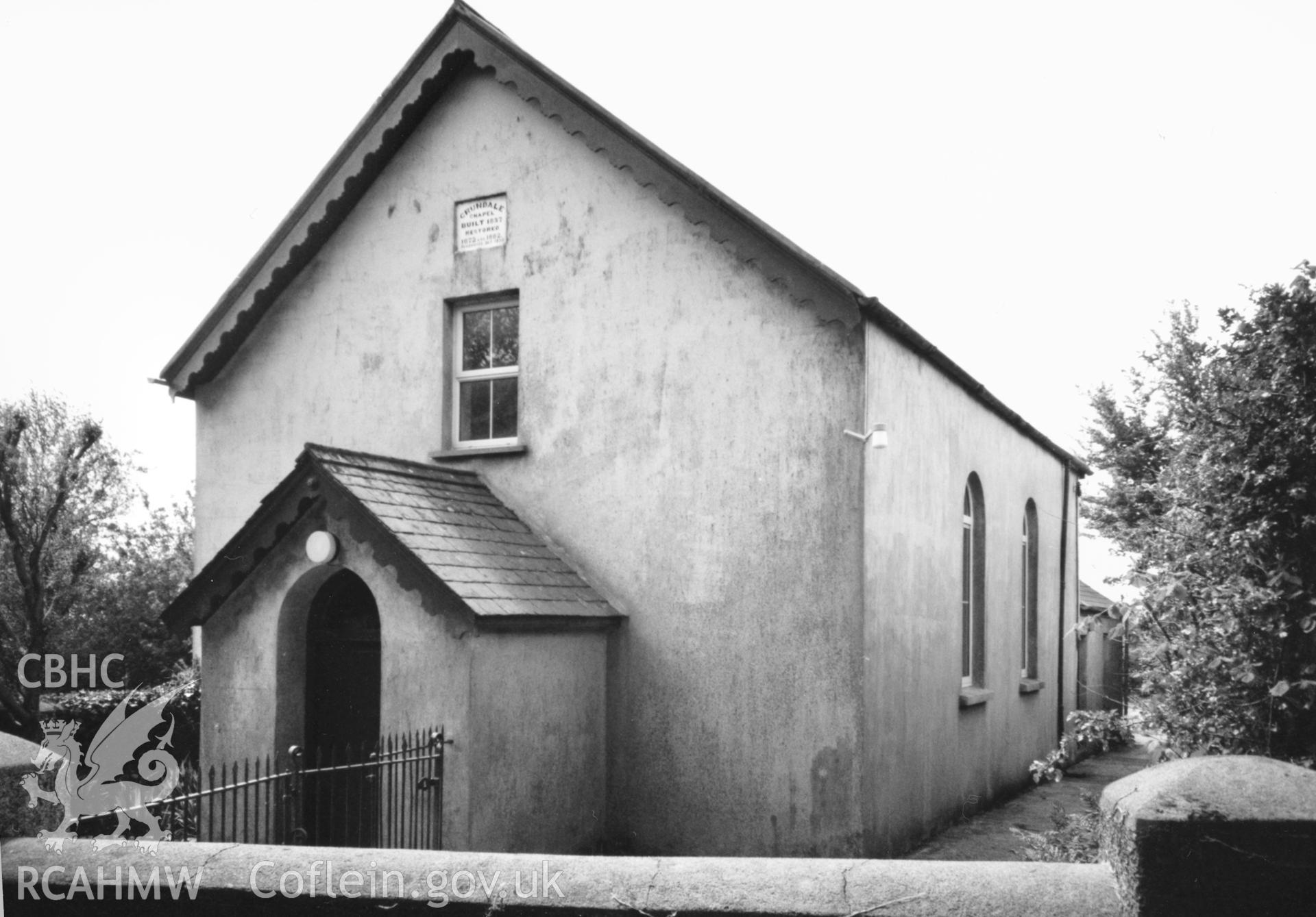 Digital copy of a black and white photograph showing an exterior view of Crundale Congregational Chapel,  taken by Robert Scourfield, 1996.