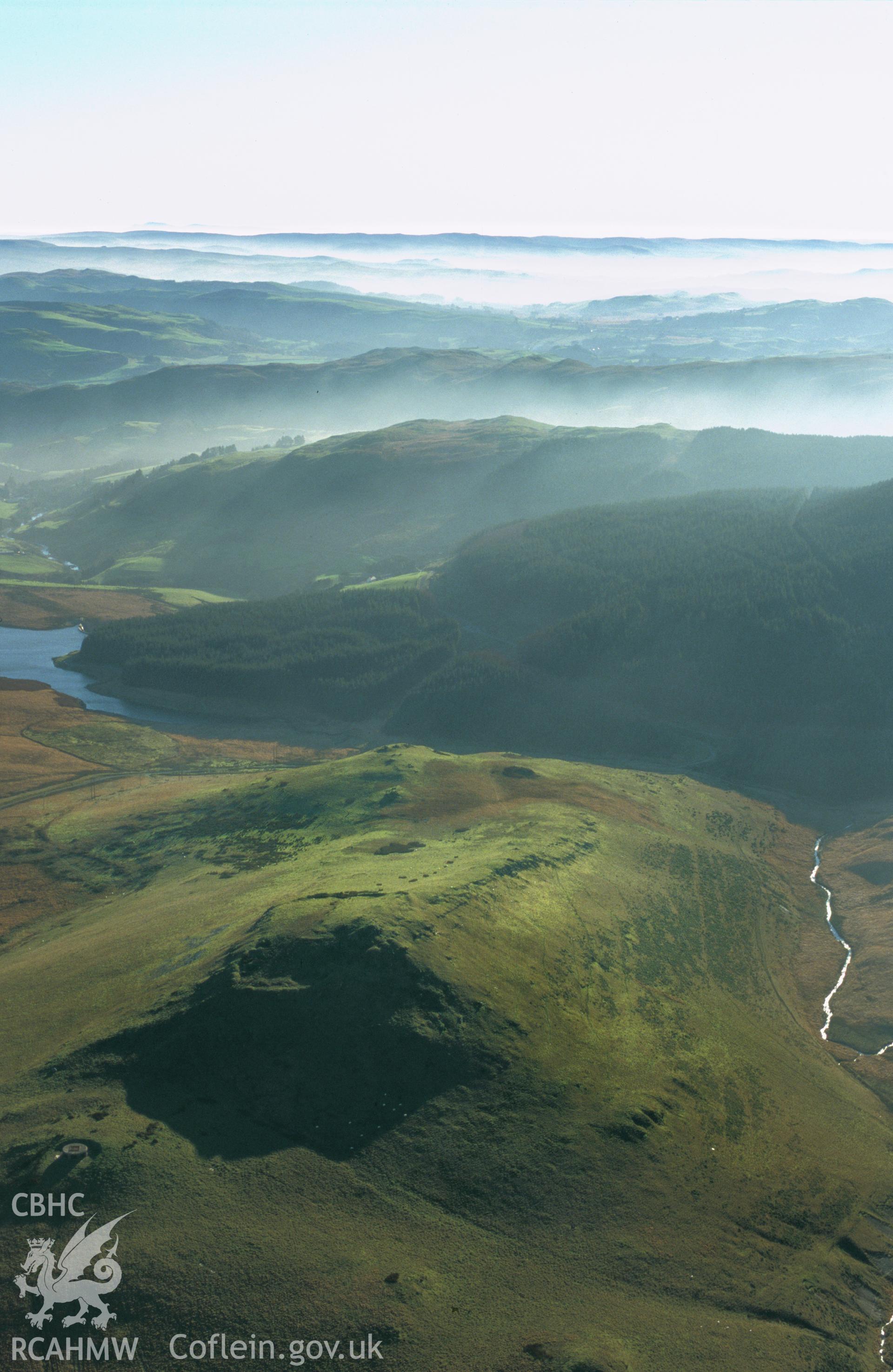 Slide of RCAHMW colour oblique aerial photograph of  Dinas Hillfort, taken by T.G. Driver, 2001.