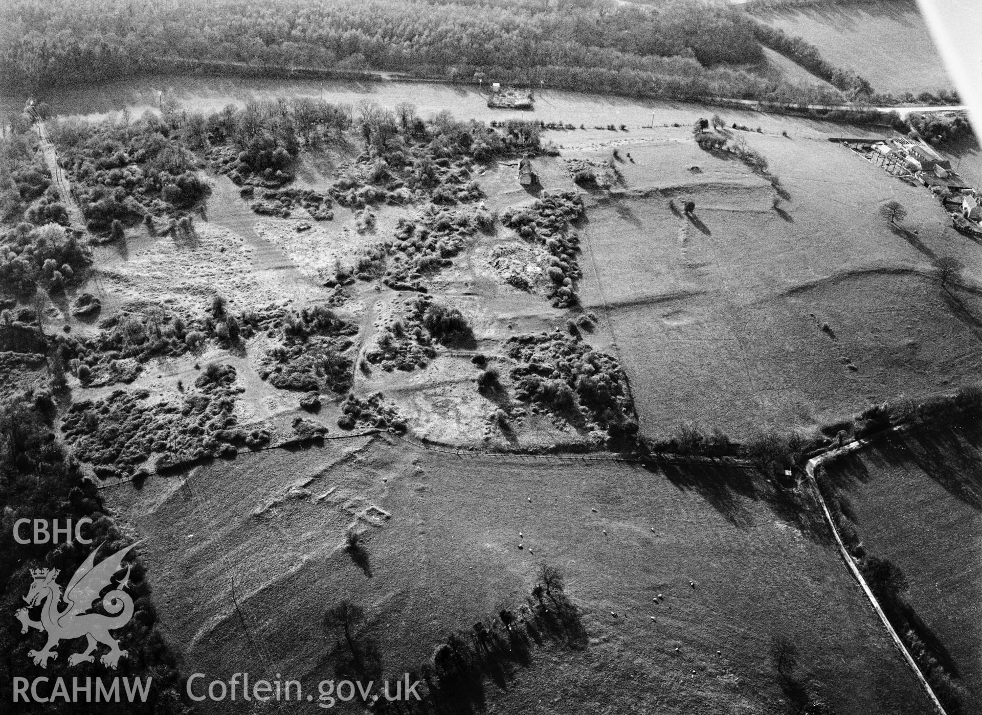 RCAHMW Black and white oblique aerial photograph of Runston Settlement Earthworks, Mathern, taken by C.R. Musson, 24/03/94