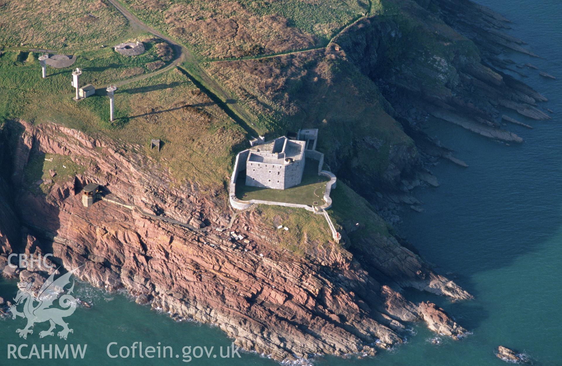 Slide of RCAHMW colour oblique aerial photograph of West Blockhouse, Dale, taken by C.R. Musson, 23/2/1993.