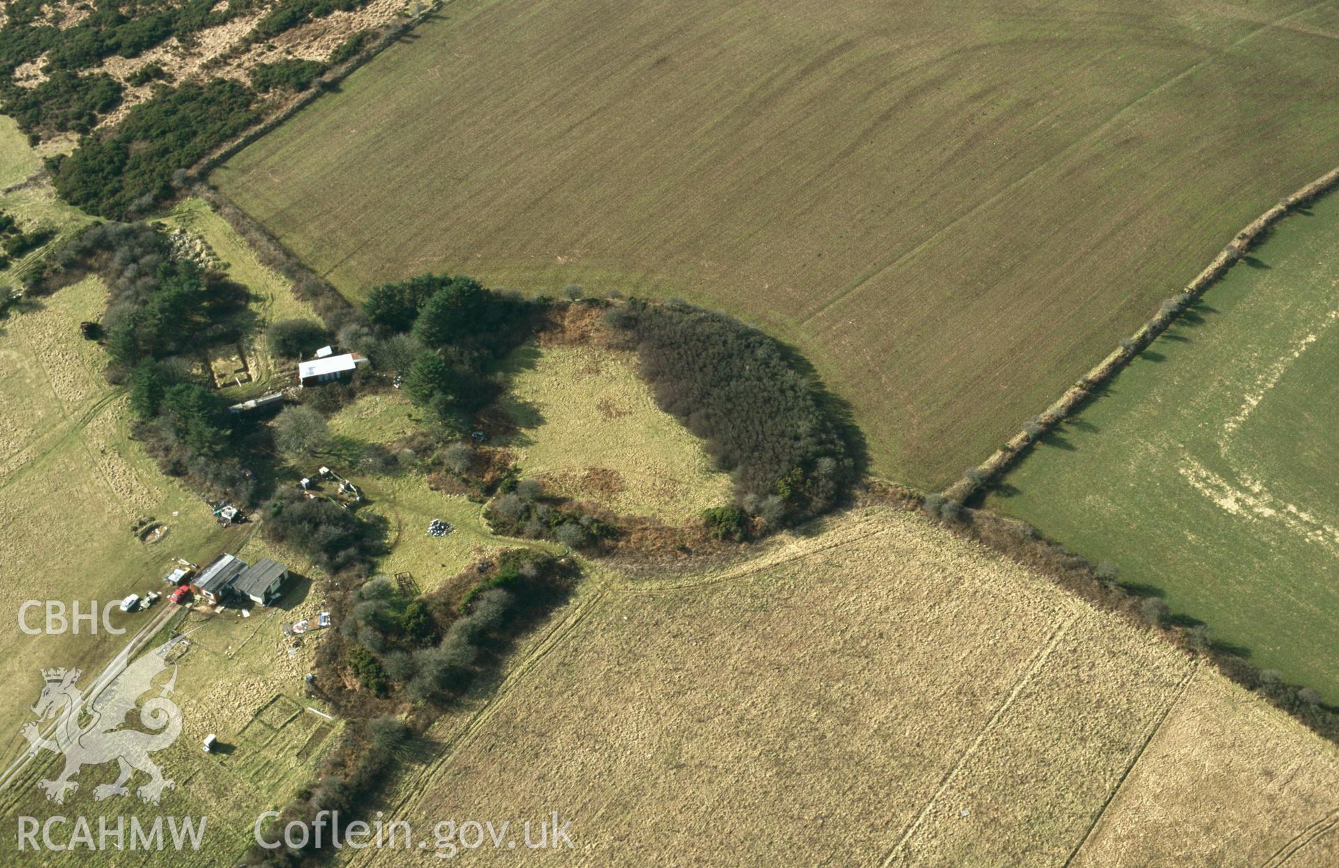 RCAHMW colour slide oblique aerial photograph of Plumstone Rath, Camrose, taken by C.R.Musson on the 27/02/1996