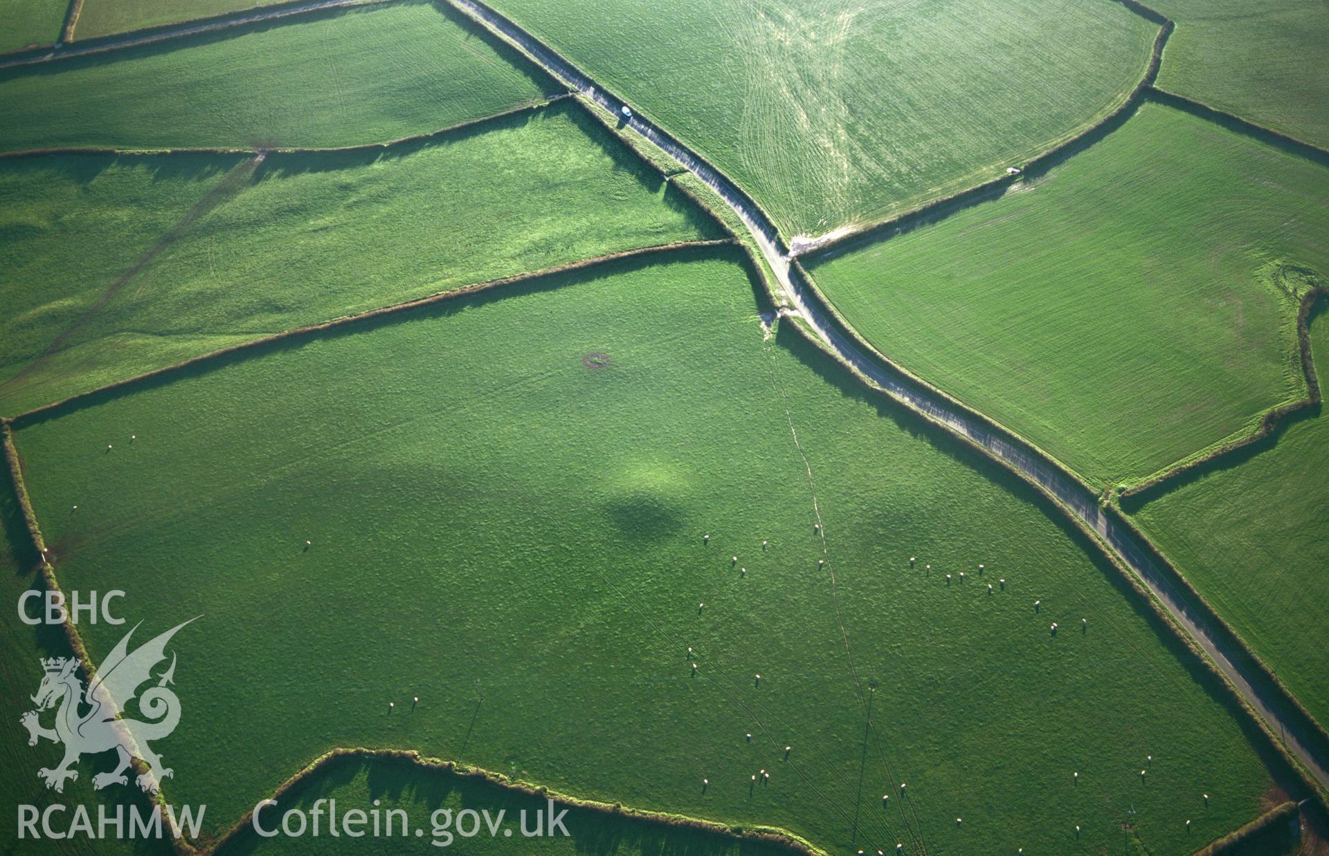 RCAHMW colour slide oblique aerial photograph of Wallaston Round Barrows IV, Hundleton, taken by T.G.Driver on the 03/12/1997