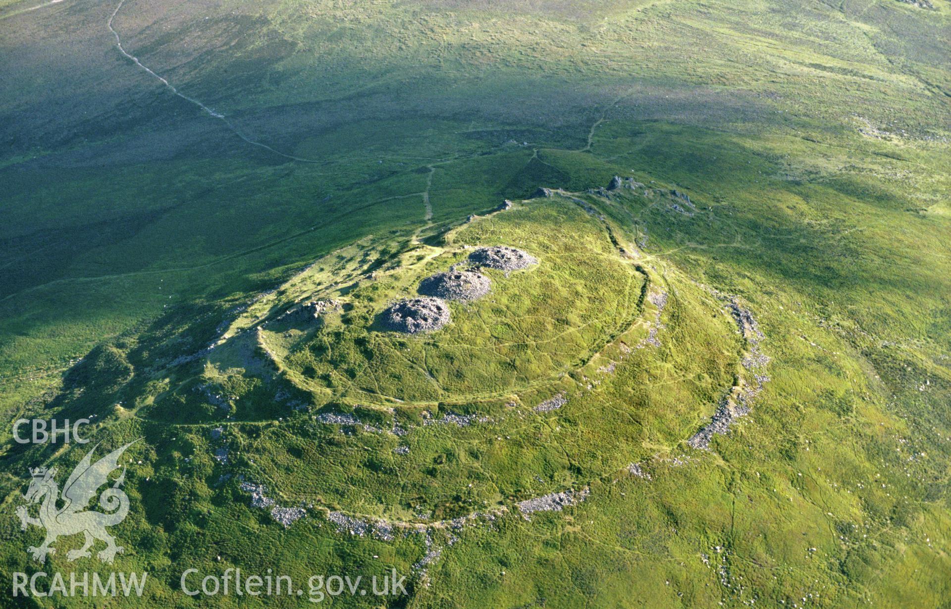 Slide of RCAHMW colour oblique aerial photograph of Foel Drygarn Camp, taken by C.R. Musson, 14/7/1989.