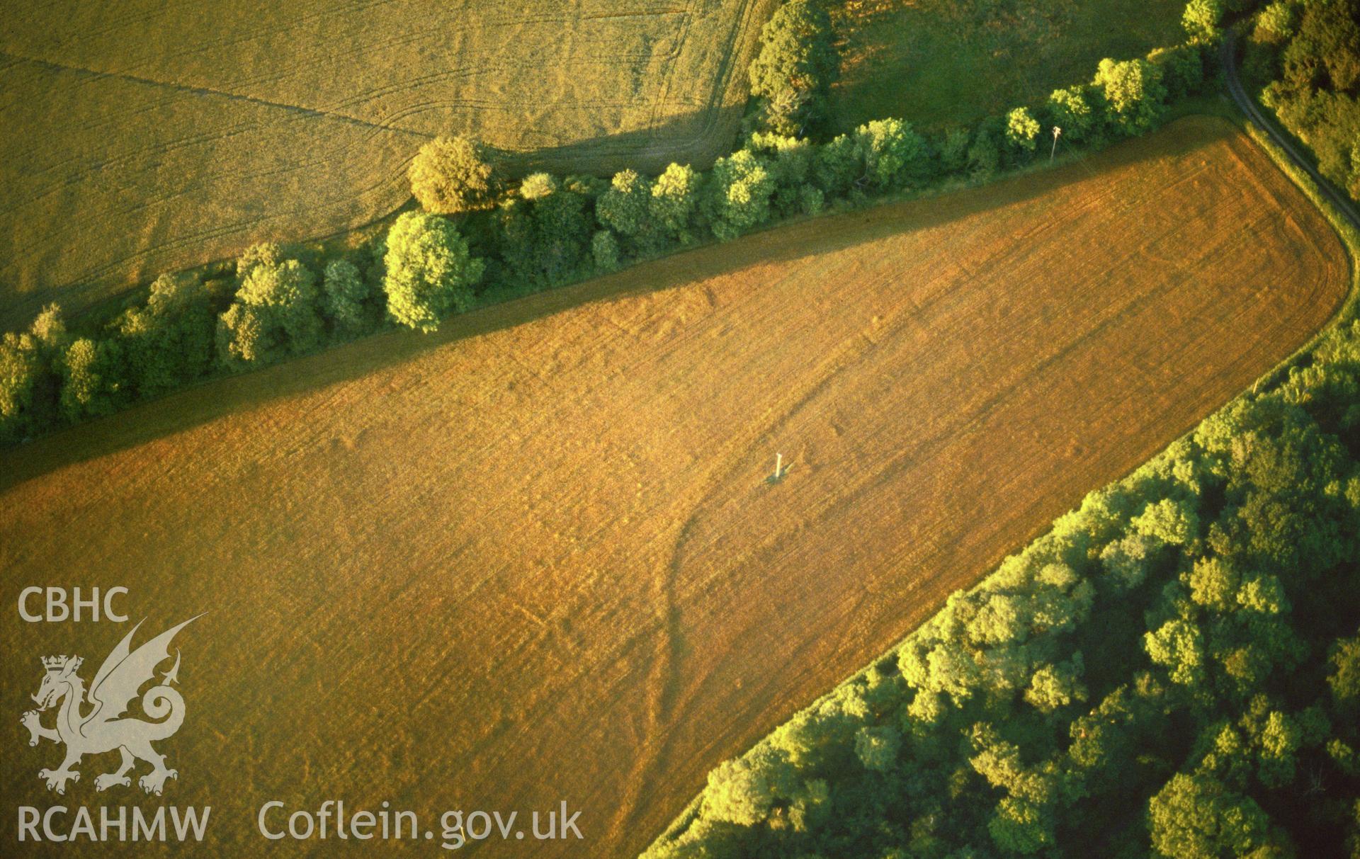 RCAHMW colour slide oblique aerial photograph of Withybush Pit Circle, Rudbaxton, taken  by CR Musson, 1990.