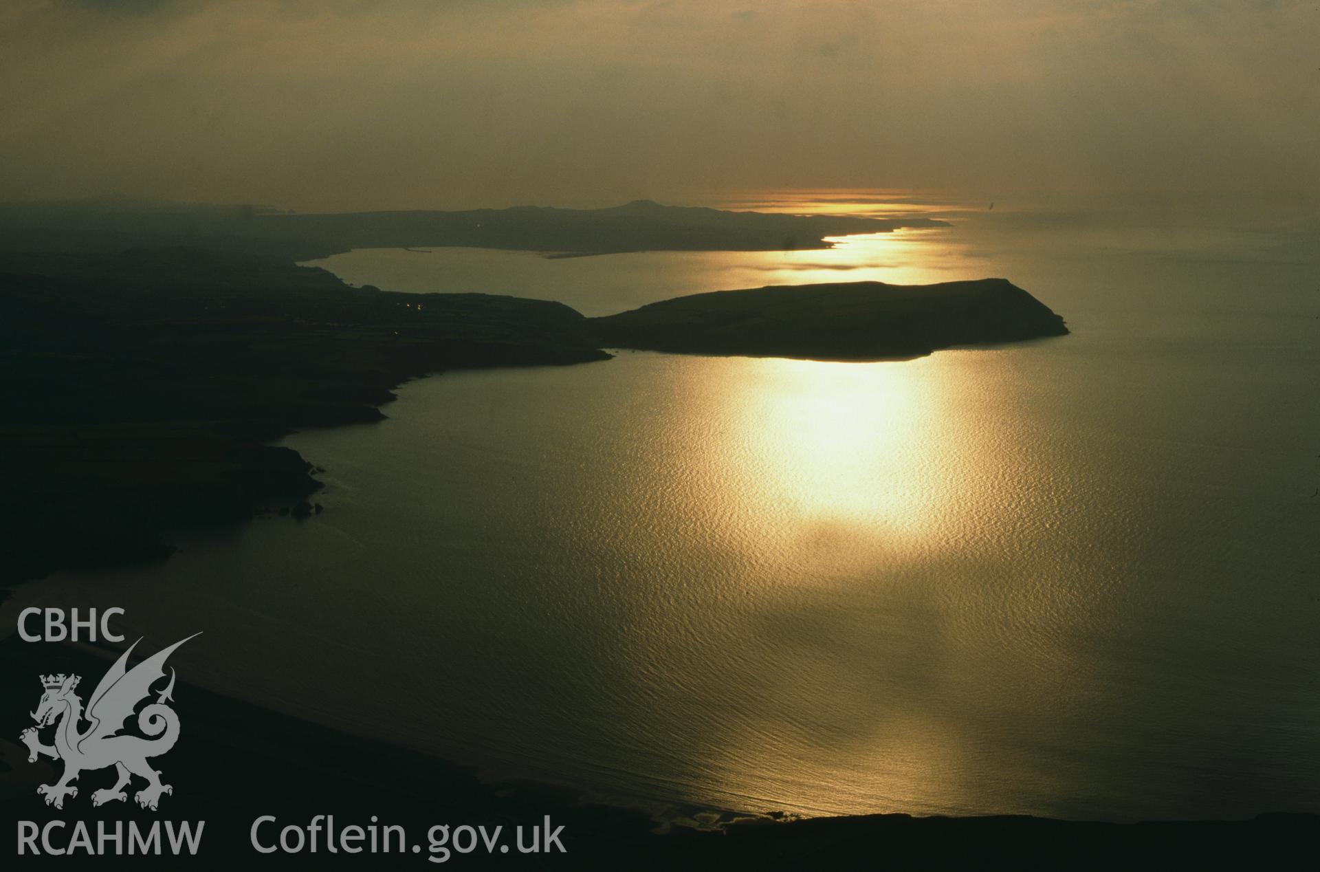 RCAHMW colour oblique aerial photograph of Dinas Head, sunset from east, landscape. Taken by Toby Driver on 02/09/2002