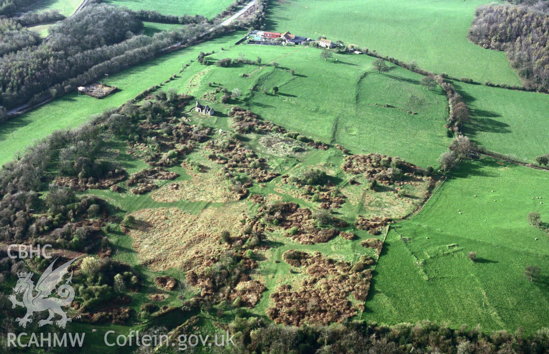 RCAHMW colour slide oblique aerial photograph of Runston Settlement Earthworks, Mathern, taken by C.R. Musson, 24/03/94