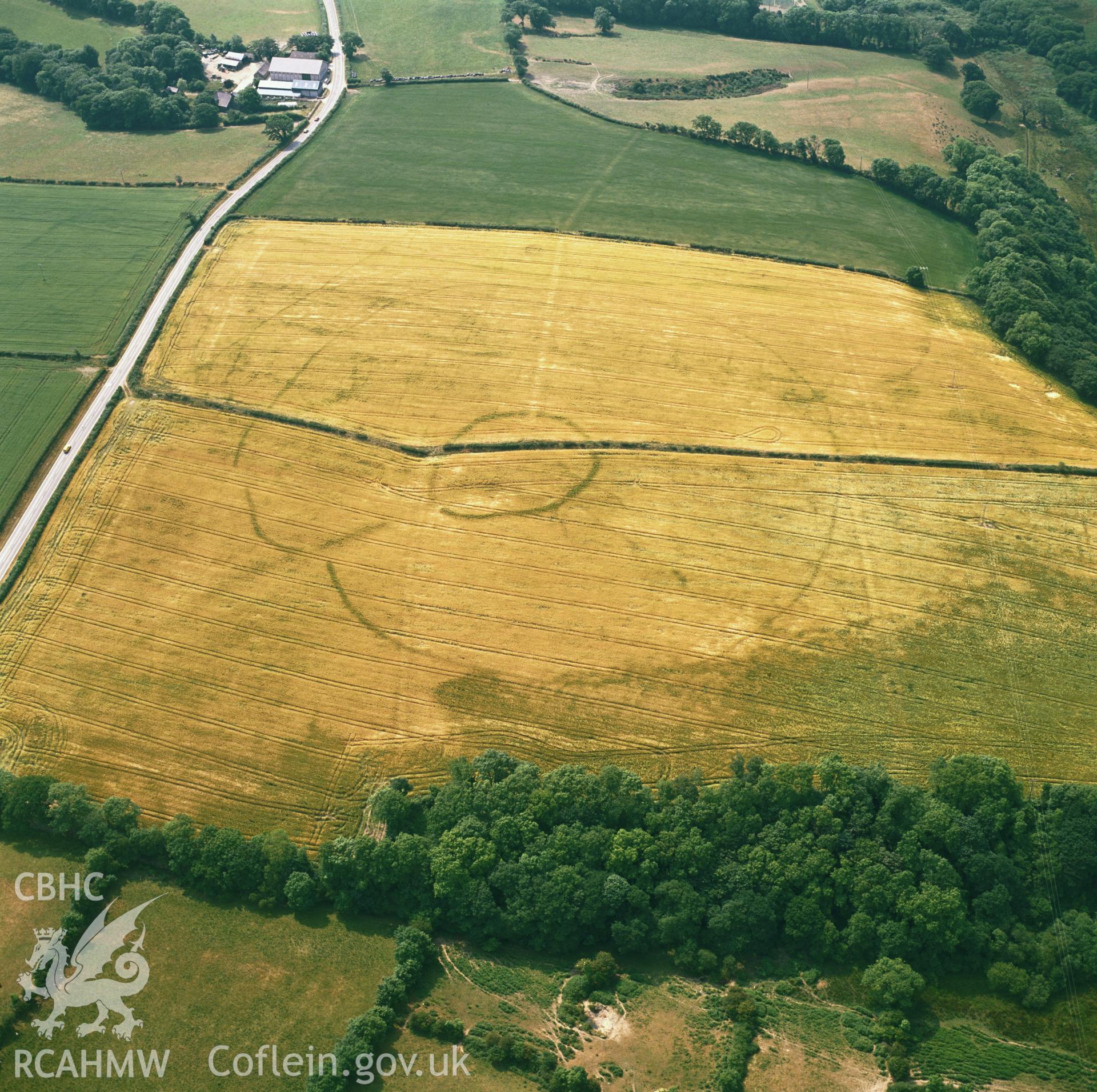 RCAHMW colour oblique aerial photograph of two circulinear enclosures near Holloway, Maenclochog, taken  by CR Musson, 1992