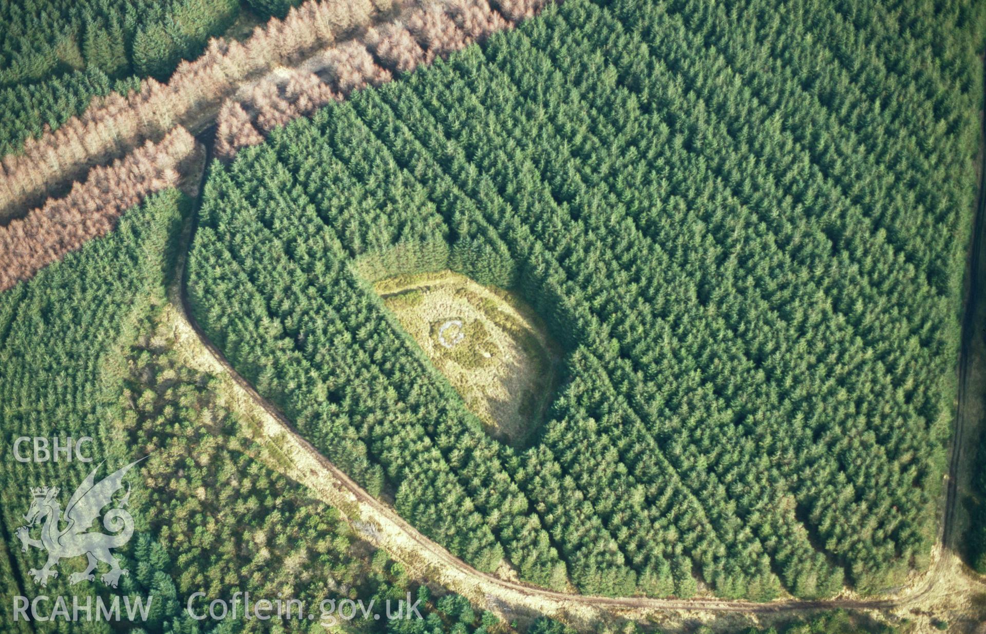 RCAHMW colour slide oblique aerial photograph of Gwersyll Enclosure, Aberdare, taken on 15/03/1999 by Toby Driver