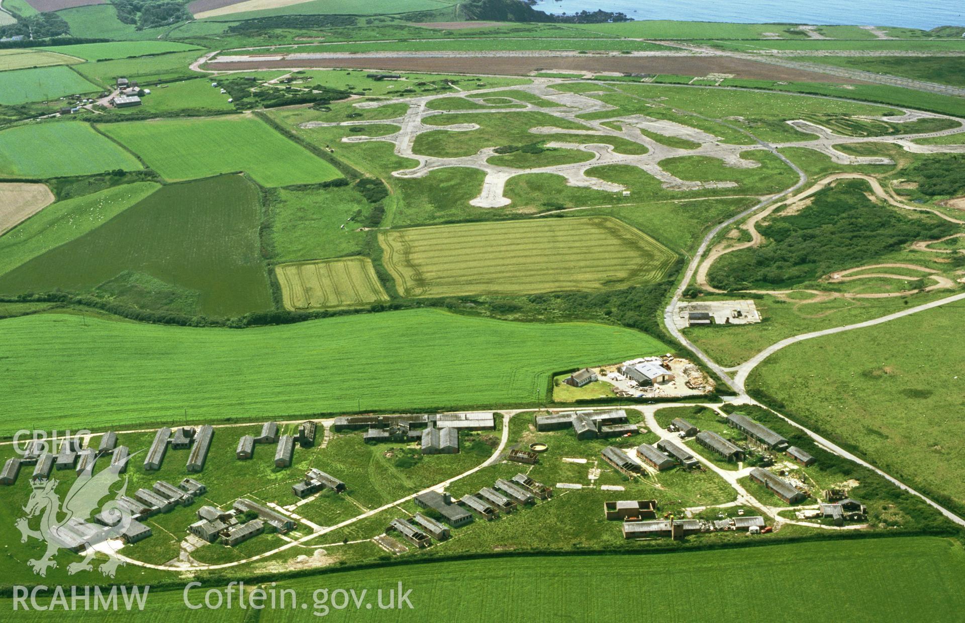 RCAHMW colour oblique aerial photograph of Dale airfield; RNAS Dale, buildings and landscape. Taken by Toby Driver on 13/06/2003