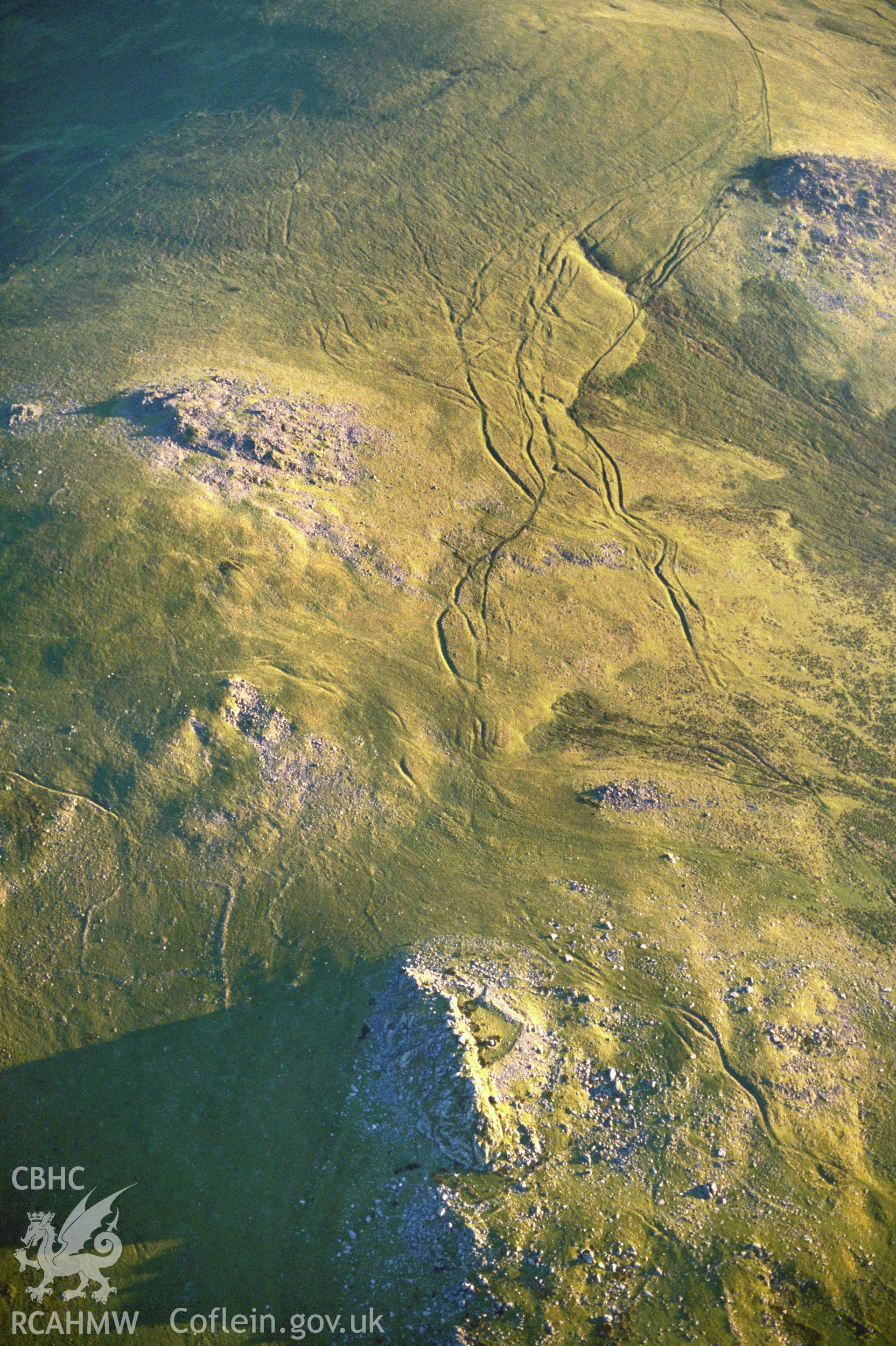 Slide of RCAHMW colour oblique aerial photograph of Carn Alw, taken by C.R. Musson, 1988.