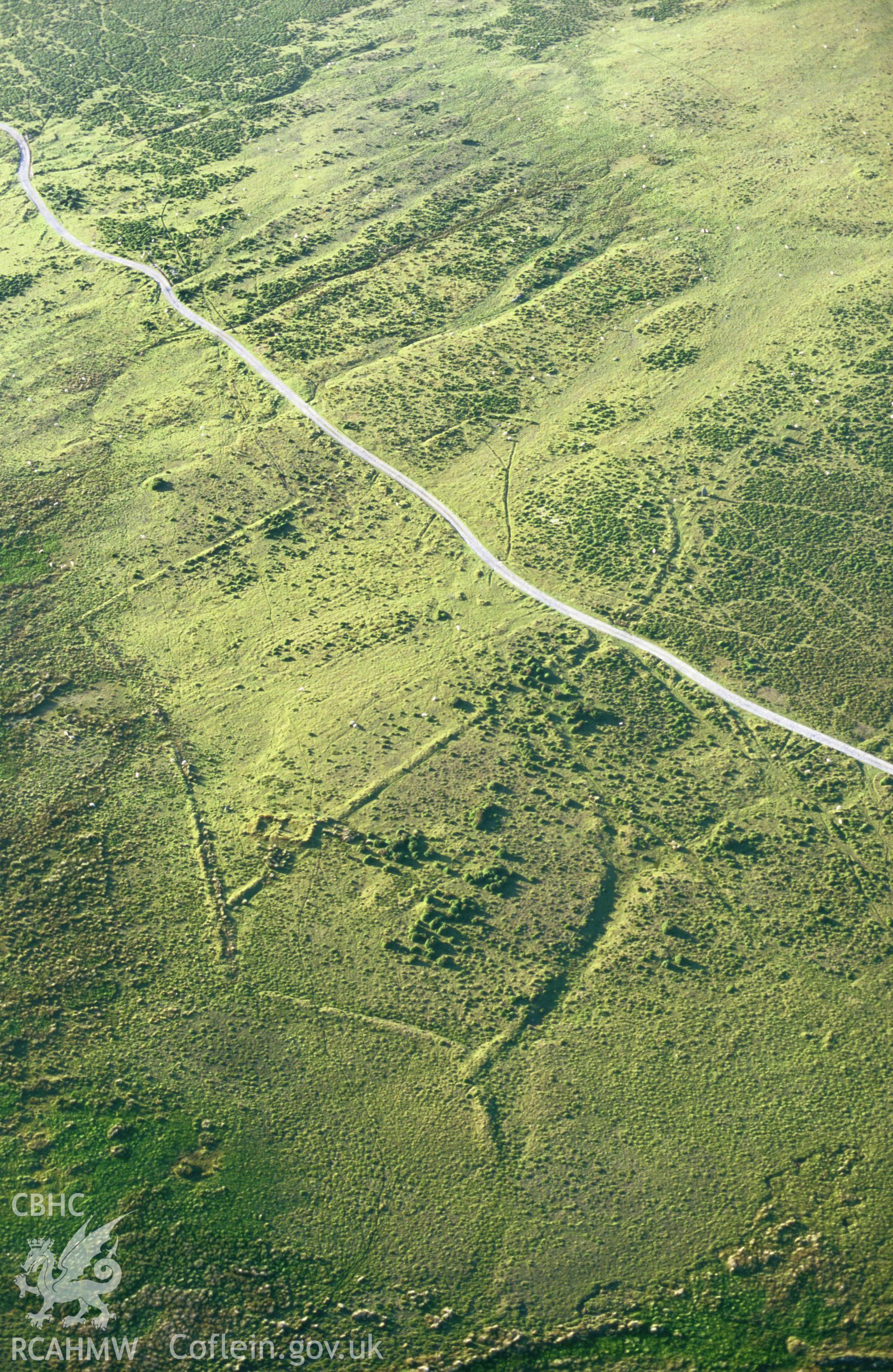 RCAHMW colour slide oblique aerial photograph of enclosure at Tafarn-y-bwlch, Eglwyswrw, taken by C.R.Musson on the 15/07/1996