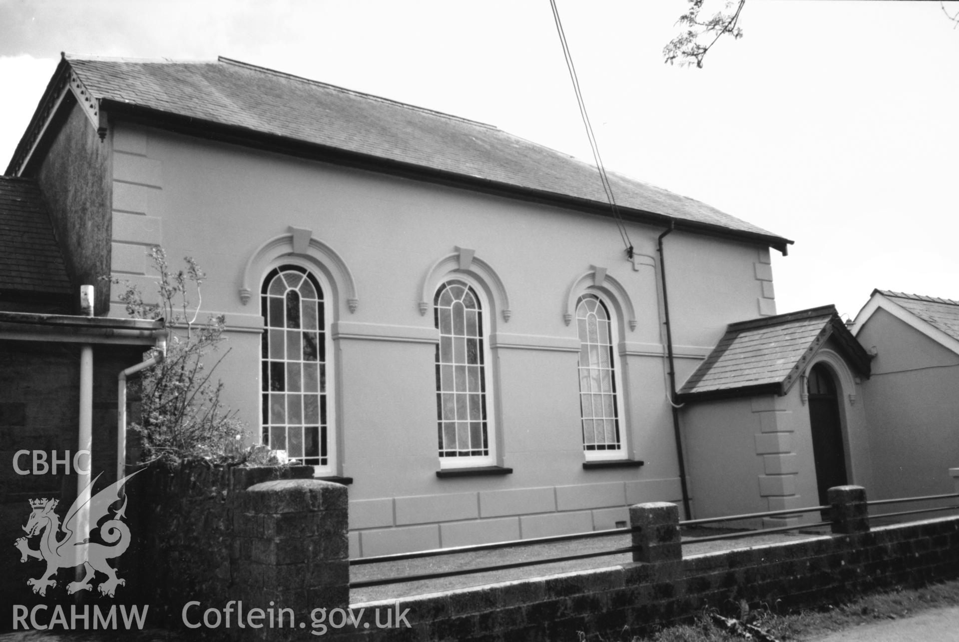 Digital copy of a black and white photograph showing an exterior view of Gwastad Calvinistic Methodist Chapel, taken by Robert Scourfield, 1996.