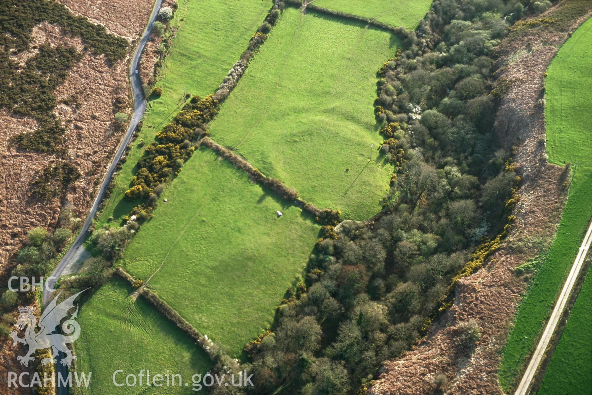 RCAHMW colour slide oblique aerial photograph of enclosure at Nant-y-coy, Wolfscastle, taken by C.R.Musson on the 28/04/1996