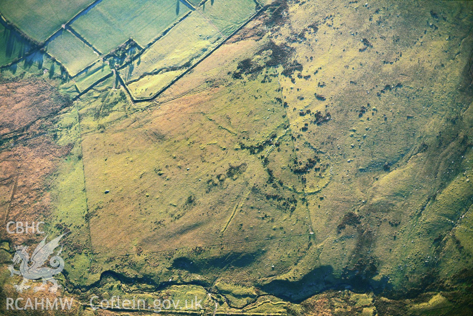 Slide of RCAHMW colour oblique aerial photograph of Waun Clyn-coch Enclosure, taken by C.R. Musson, 15/12/1990.