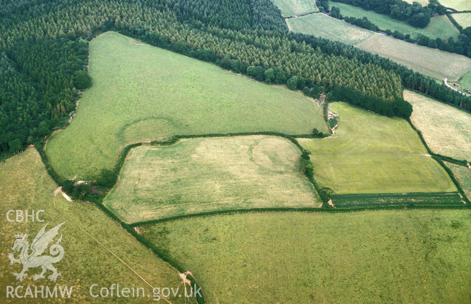 Slide of RCAHMW colour oblique aerial photograph of Woodside Camp, Llawhaden, taken by C.R. Musson, 1989.