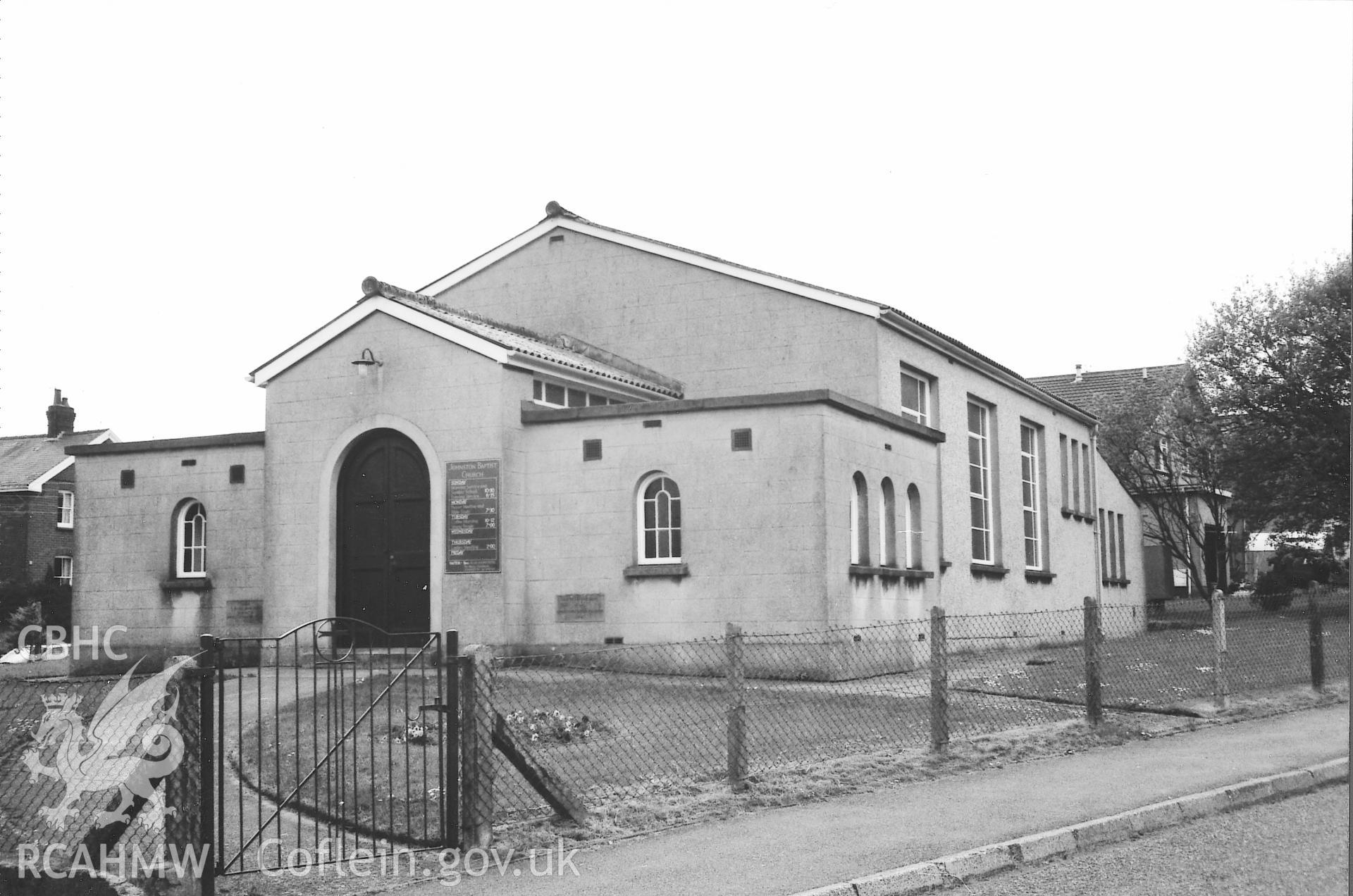 Digital copy of a black and white photograph showing an exterior view of Johnston Chapel, Carmarthen, taken by Robert Scourfield, 1995.