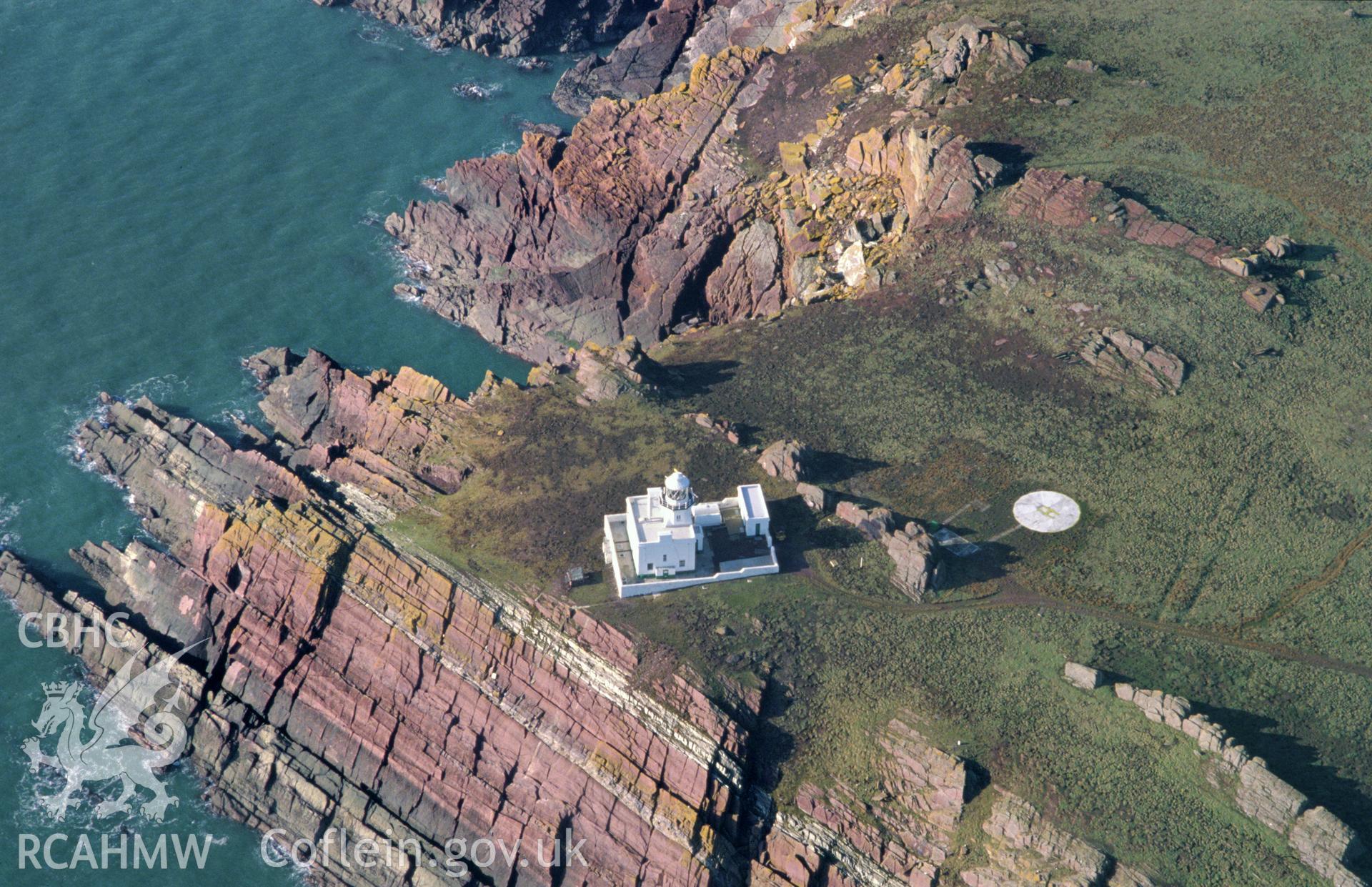 Slide of RCAHMW colour oblique aerial photograph of Skokholm Island Lighthouse, taken by C.R. Musson, 1993.