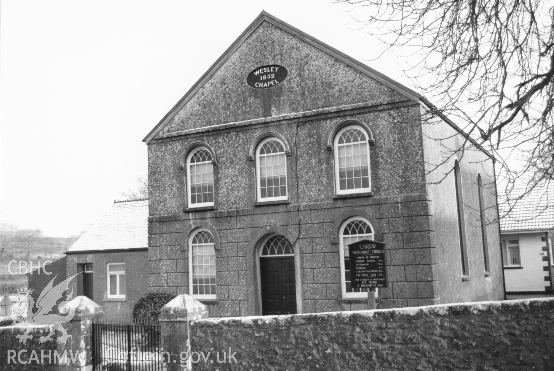 Digital copy of a black and white photograph showing exterior view of Carew Wesleyan Methodist Chapel, taken by Robert Scourfield, 1996.