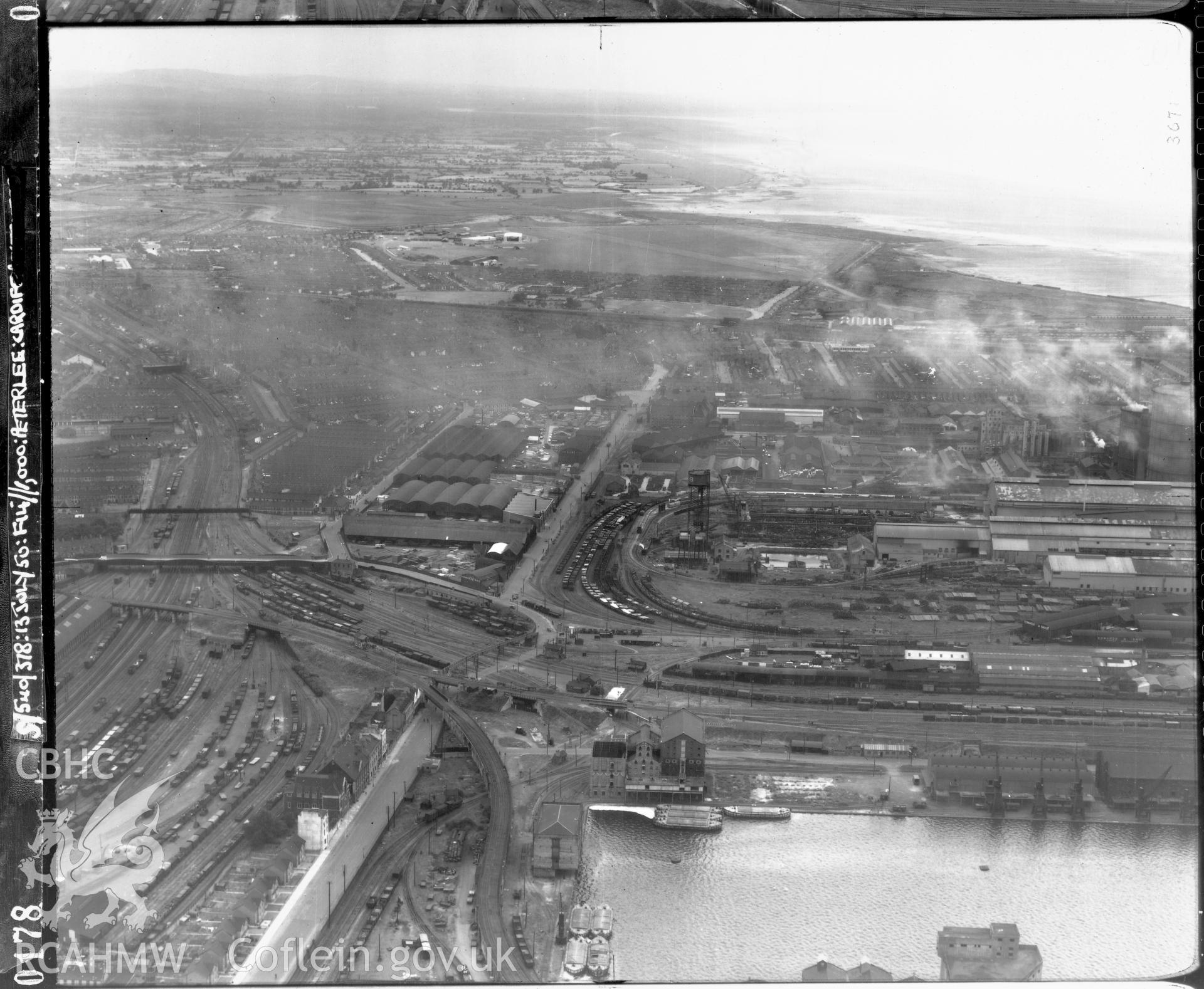 Black and white low level oblique aerial photograph taken by the RAF 1950 centred on Cardiff Bay.