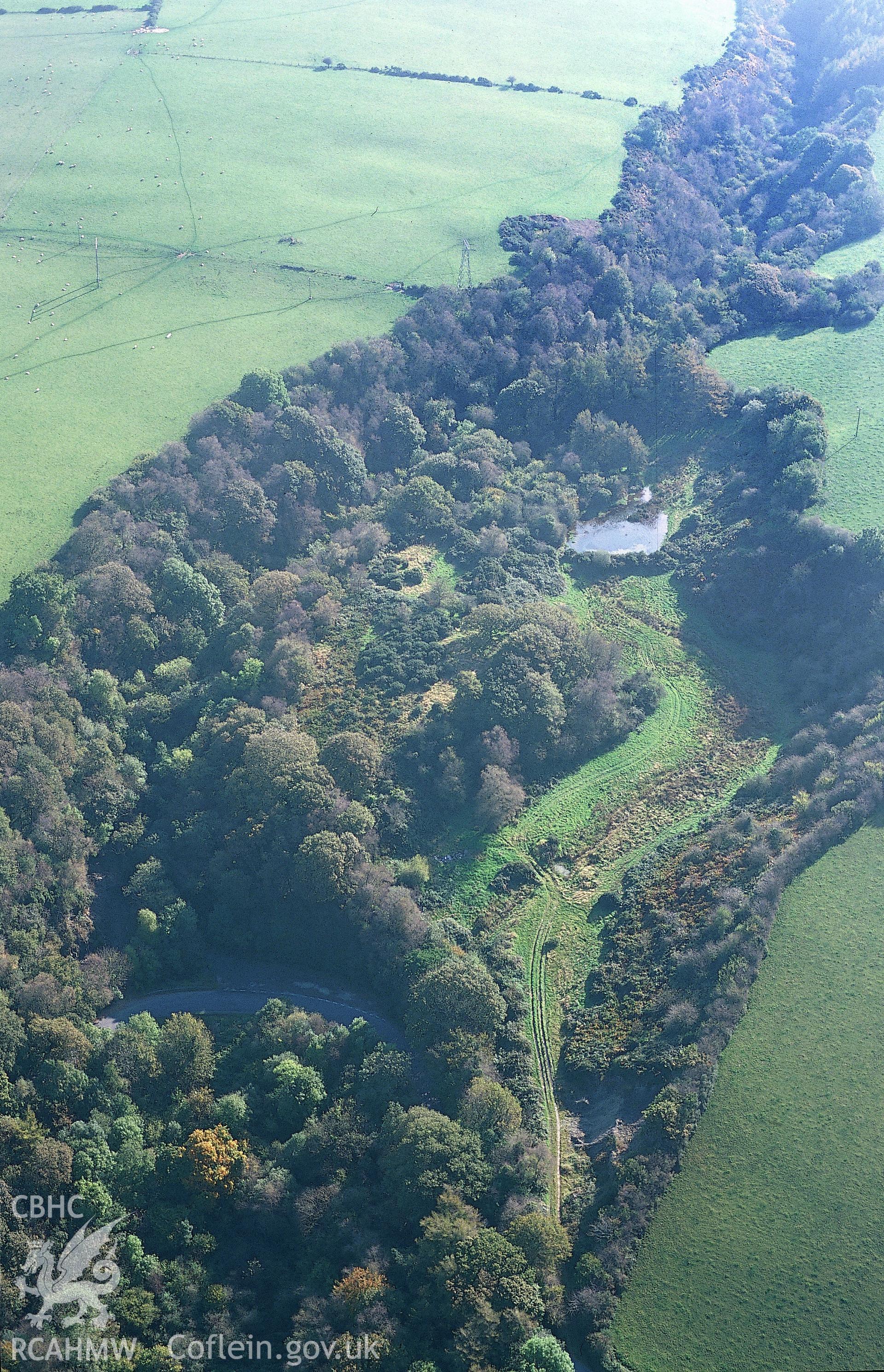 RCAHMW colour slide oblique aerial photograph of Cwm Castell, Llanarth, taken on 19/10/1999 by Toby Driver