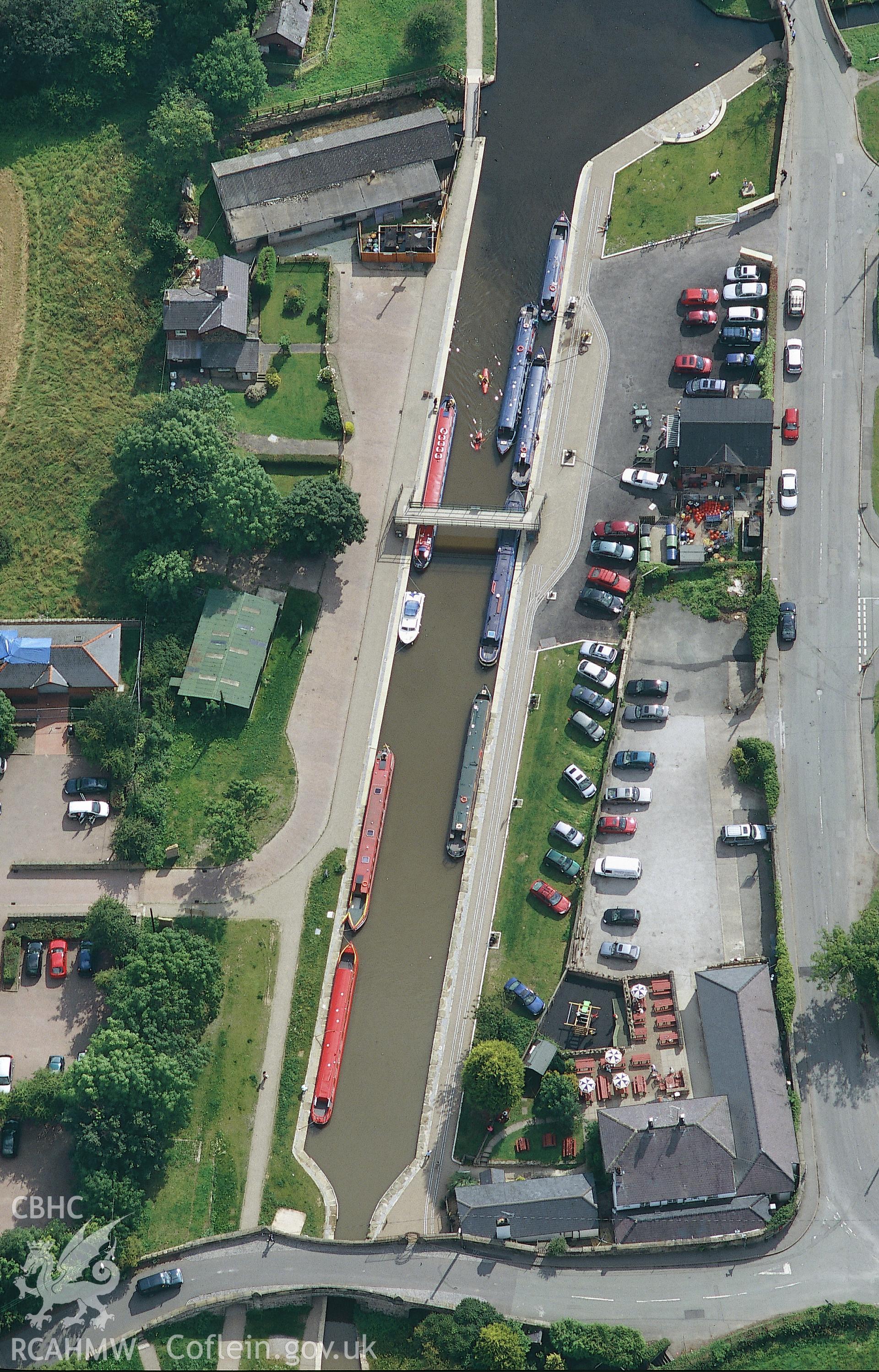 RCAHMW colour oblique aerial photograph of Trefor Wharf taken on 30/07/2004 by Toby Driver