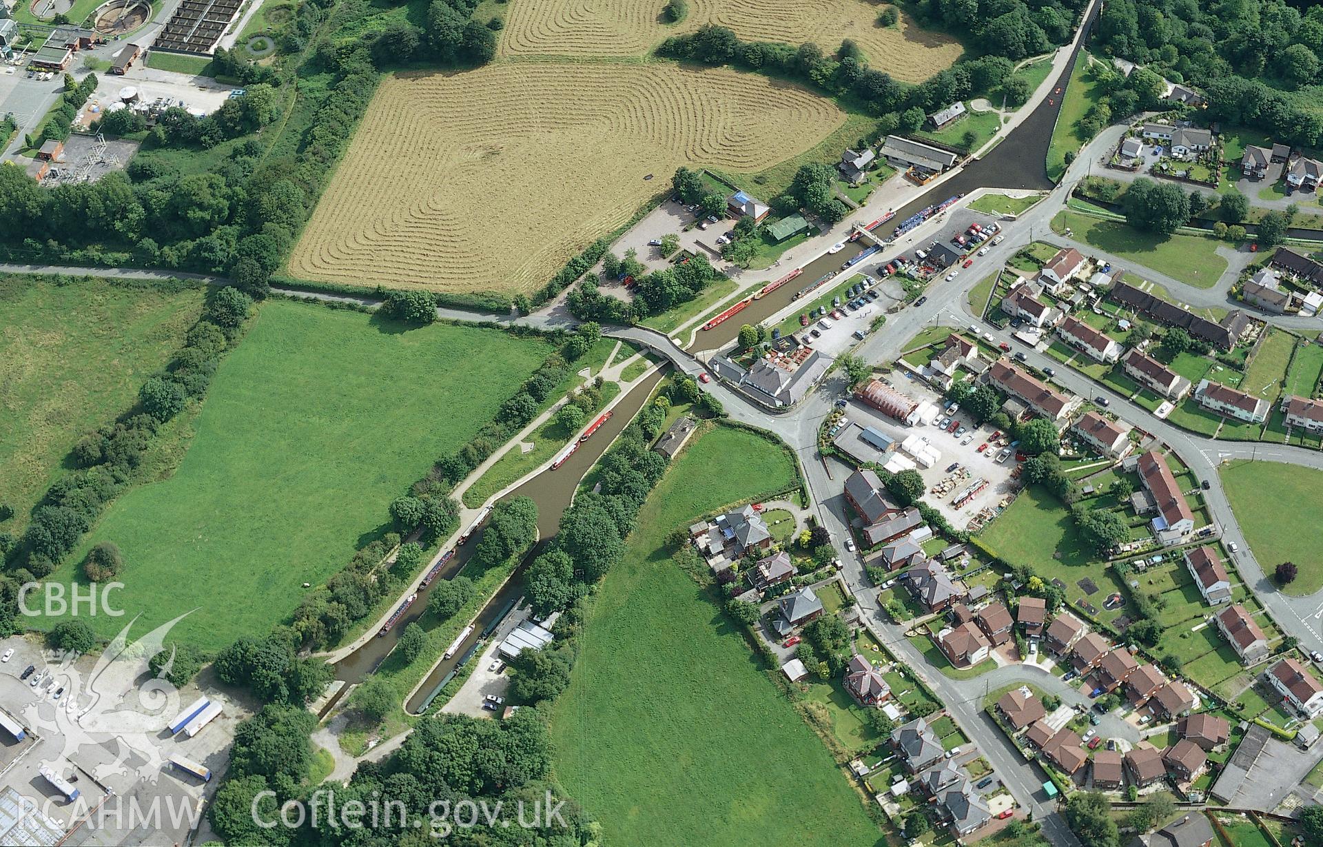 RCAHMW colour oblique aerial photograph of Trefor Wharf taken on 30/07/2004 by Toby Driver