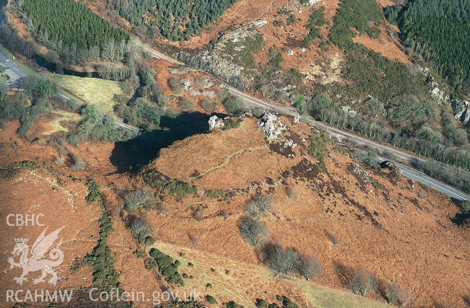 RCAHMW colour slide oblique aerial photograph of enclosure at Great Treffgarne Rocks, Wolfscastle, taken by C.R. Musson on the 27/02/1996.