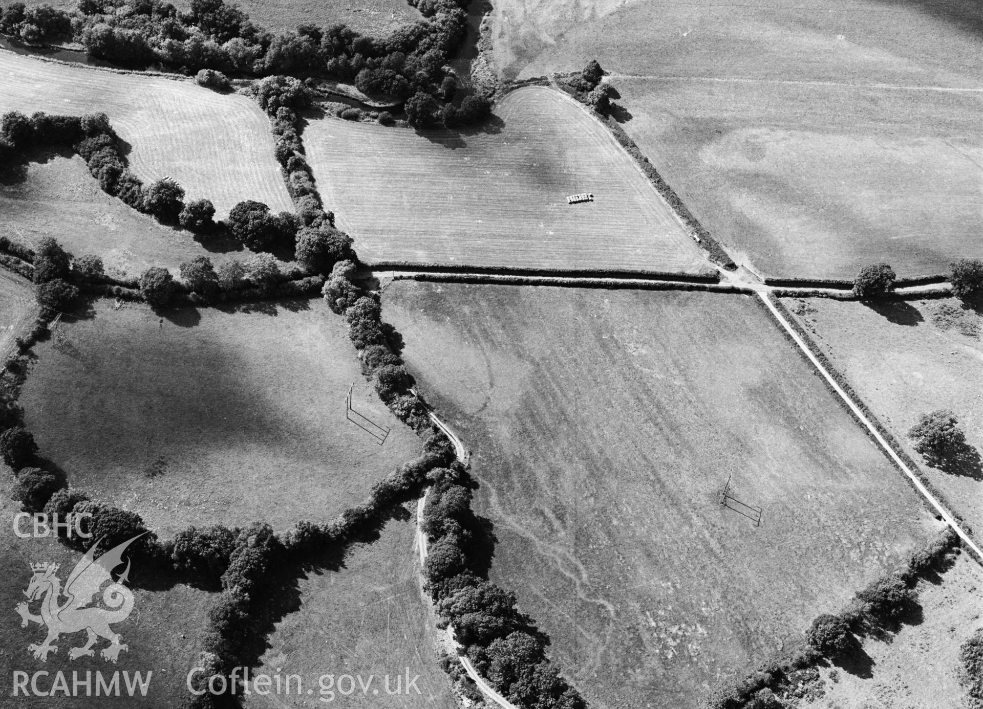 RCAHMW black and white oblique aerial photograph of cropmarks at Pentre, Llanfairclydogan, taken 1995.