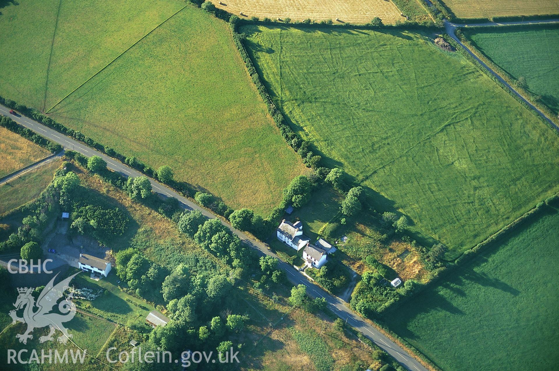 RCAHMW colour slide oblique aerial photograph of cropmark at Maesgwyn, Beulah, taken by C.R.Musson on the 15/07/1996
