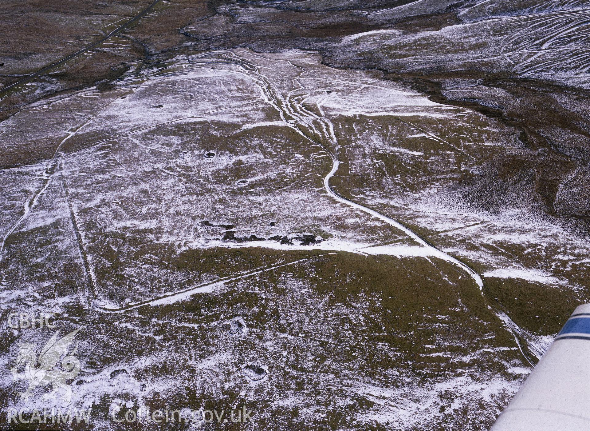 RCAHMW colour oblique aerial photograph of the Roman Camp at Esgair Perfedd, taken by C.R. Musson, 1990