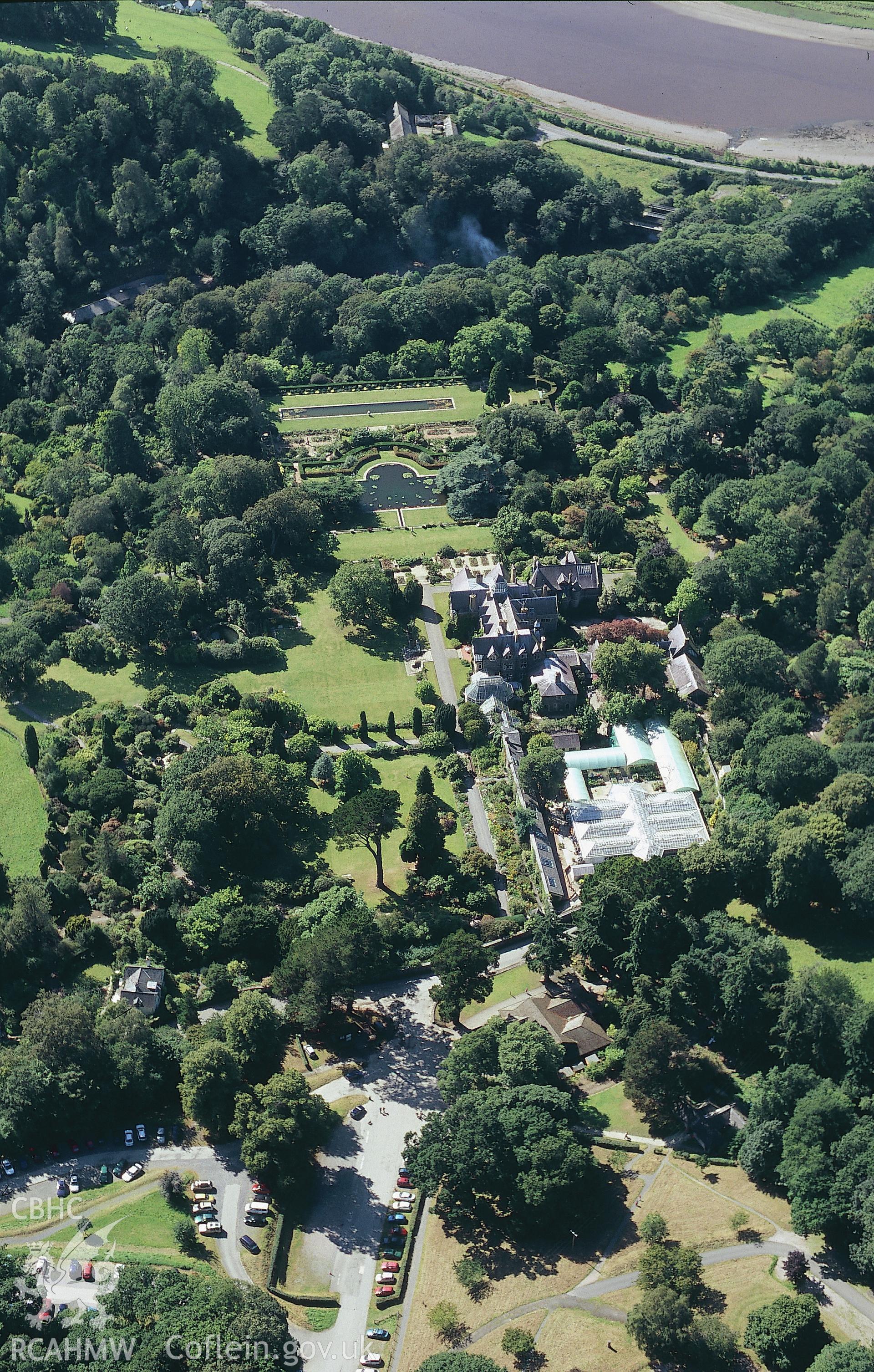 RCAHMW colour oblique aerial photograph showing the gardens at Bodnant, near Conway. Taken by Toby Driver 2004.