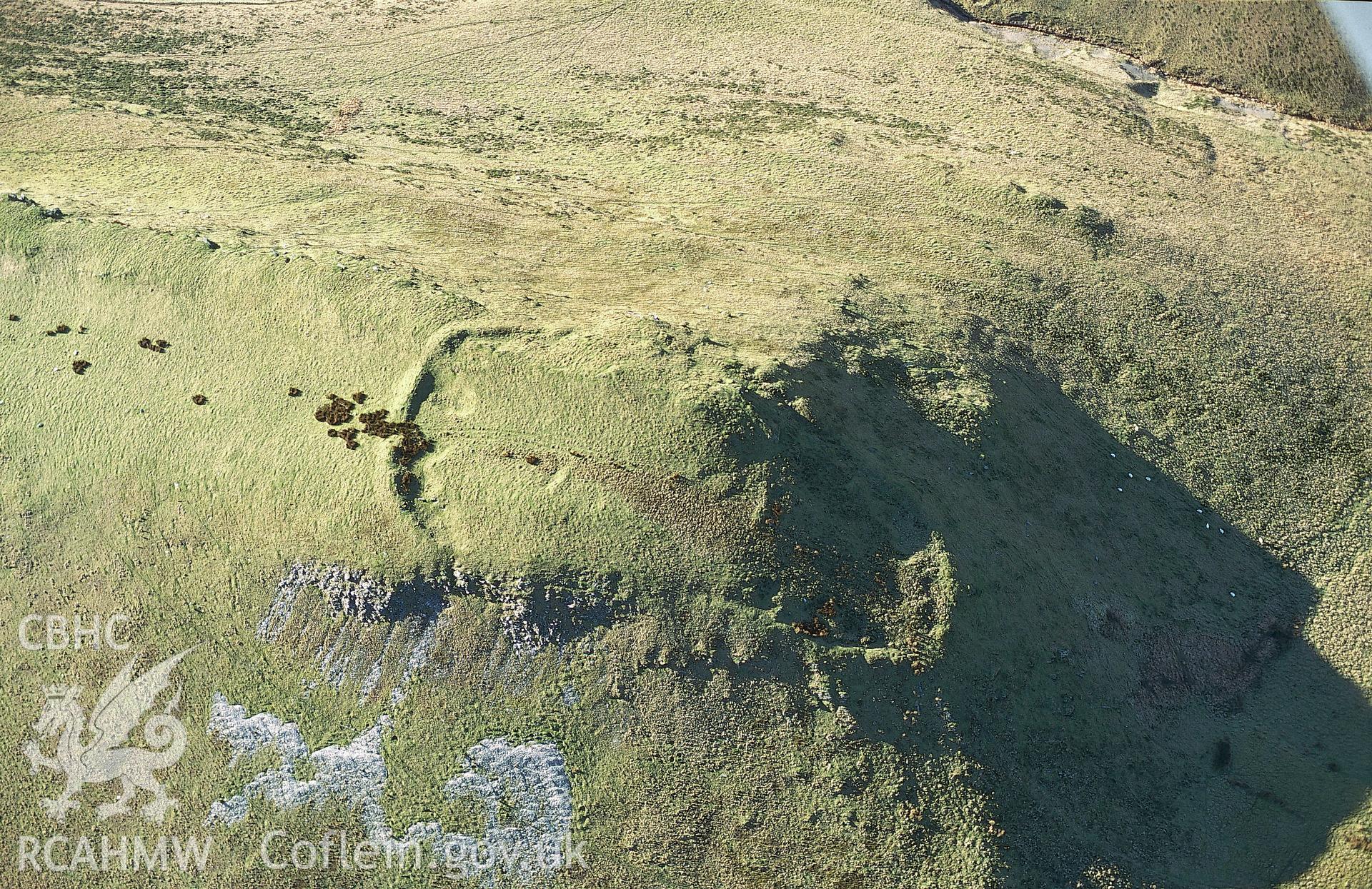 Slide of RCAHMW colour oblique aerial photograph of  Dinas Hillfort, taken by T.G. Driver, 2001.