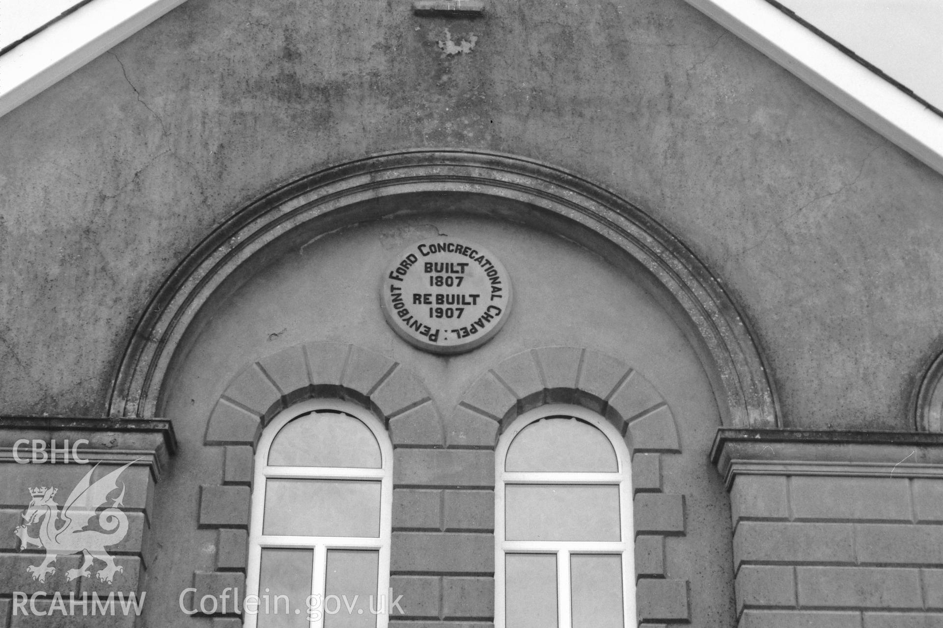 Digital copy of a black and white photograph showing a  view of the datestone at Pen y Bont Independent Chapel, Hayscastle, taken by Robert Scourfield, 1996.