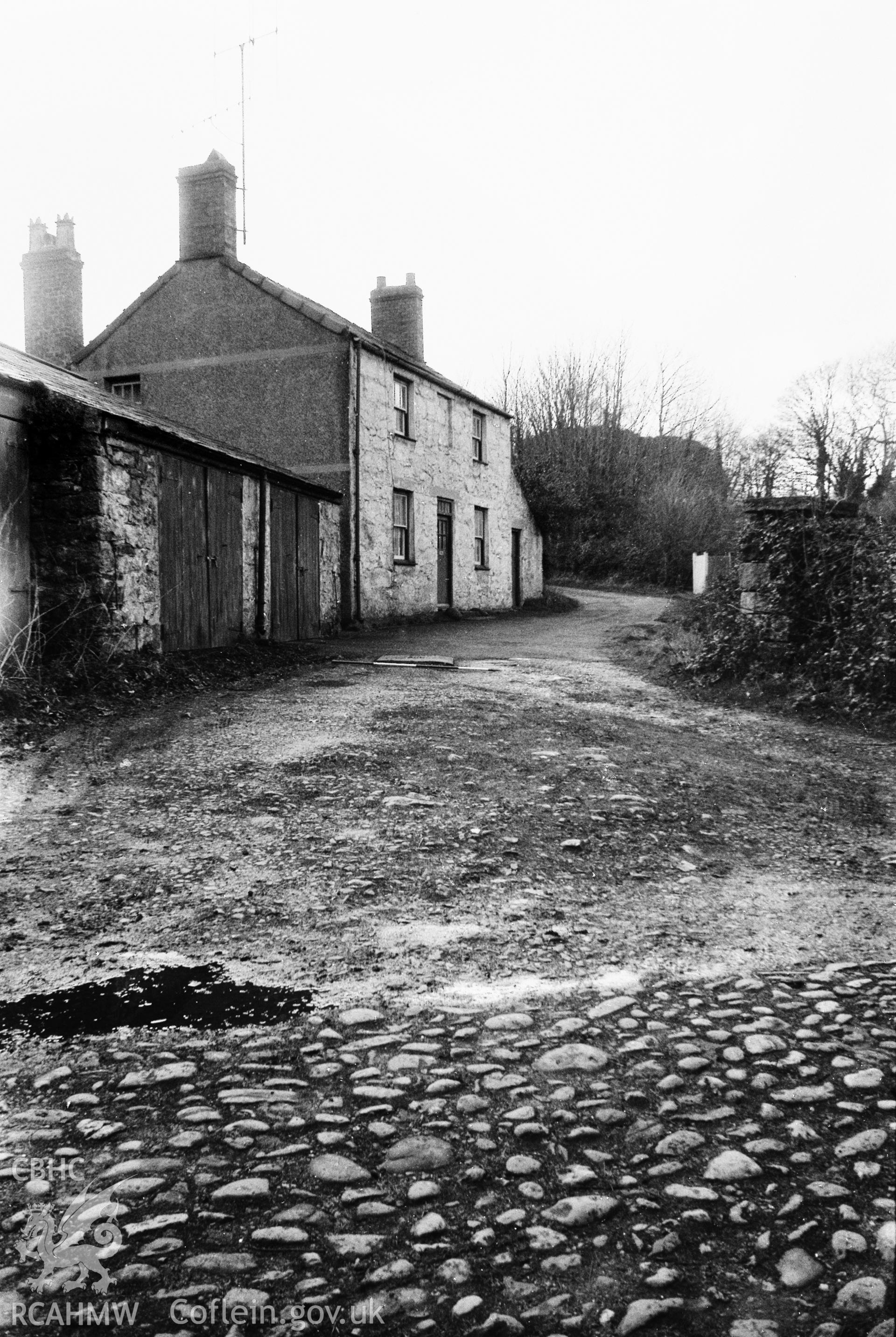 View of cobbled road and cottage at Penlan Flint Mill