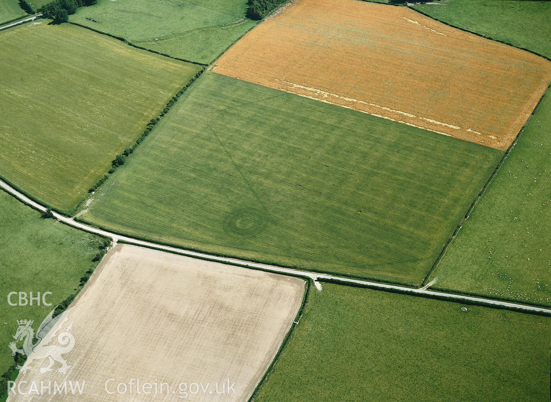 RCAHMW colour oblique aerial photograph of Hindwell marching Camp, taken by C R Musson, 1989.